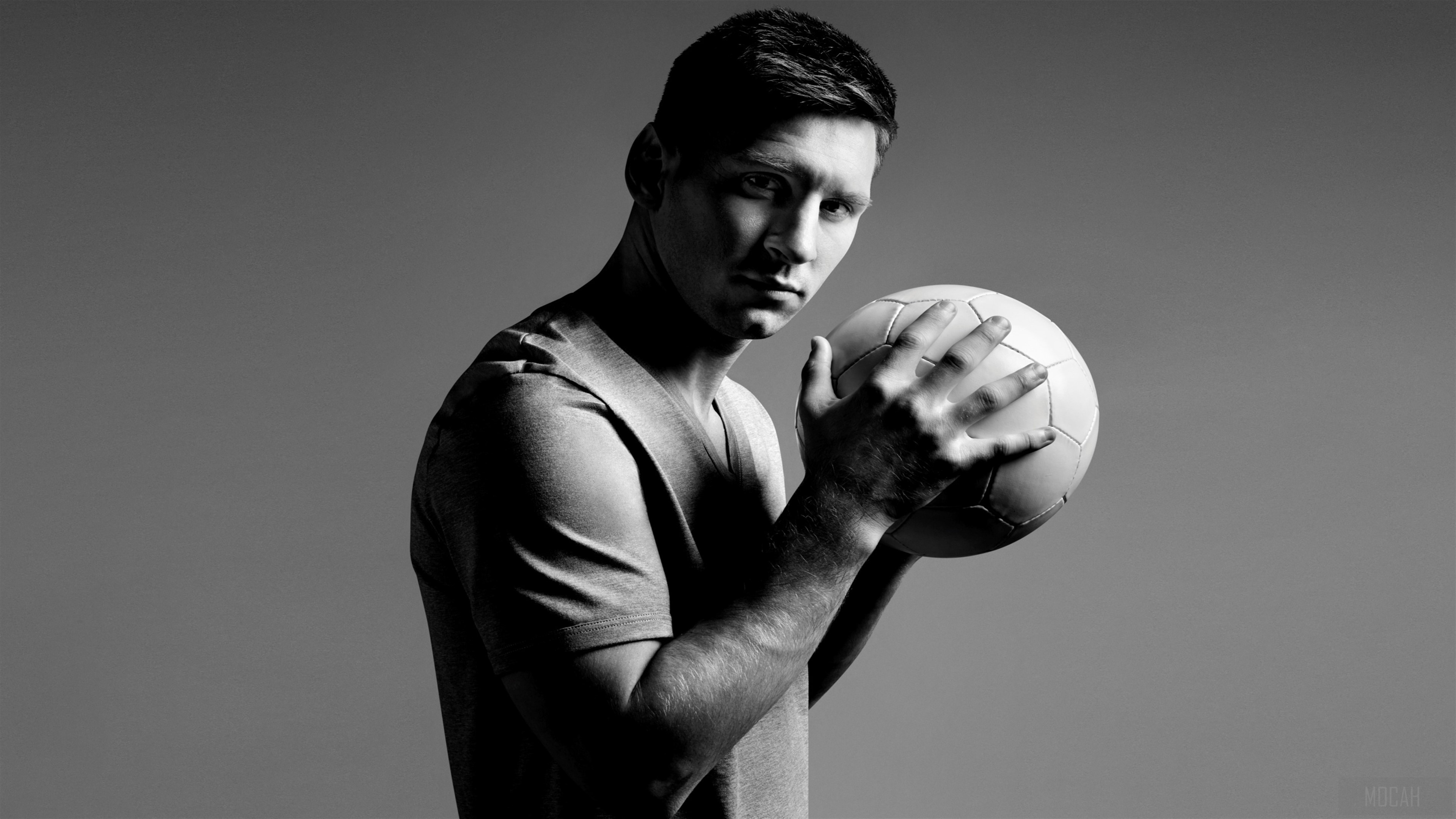 Lionel Messi holding a soccer ball HD Wallpaper