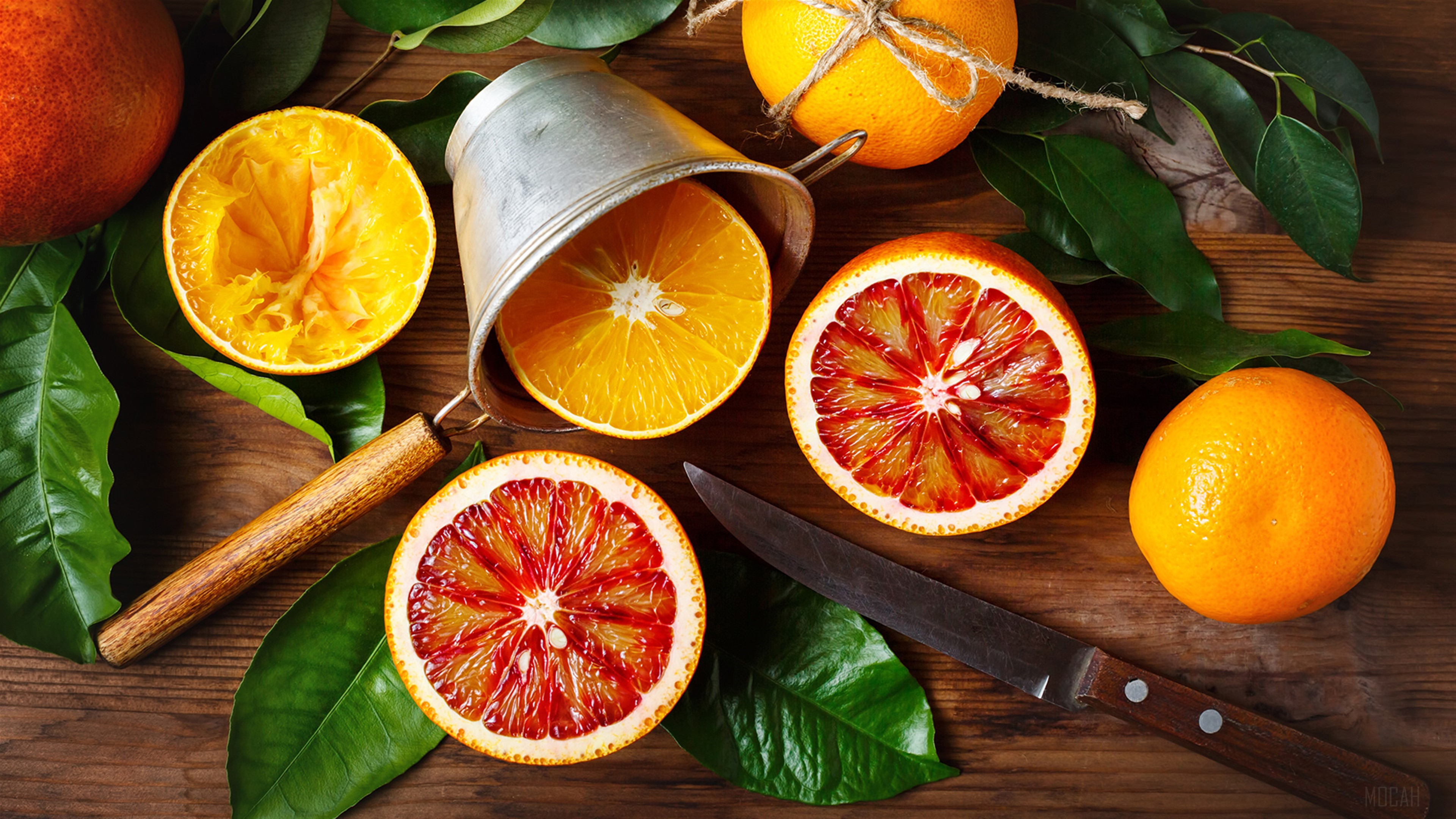 Oranges and blood oranges on a wooden table HD Wallpaper