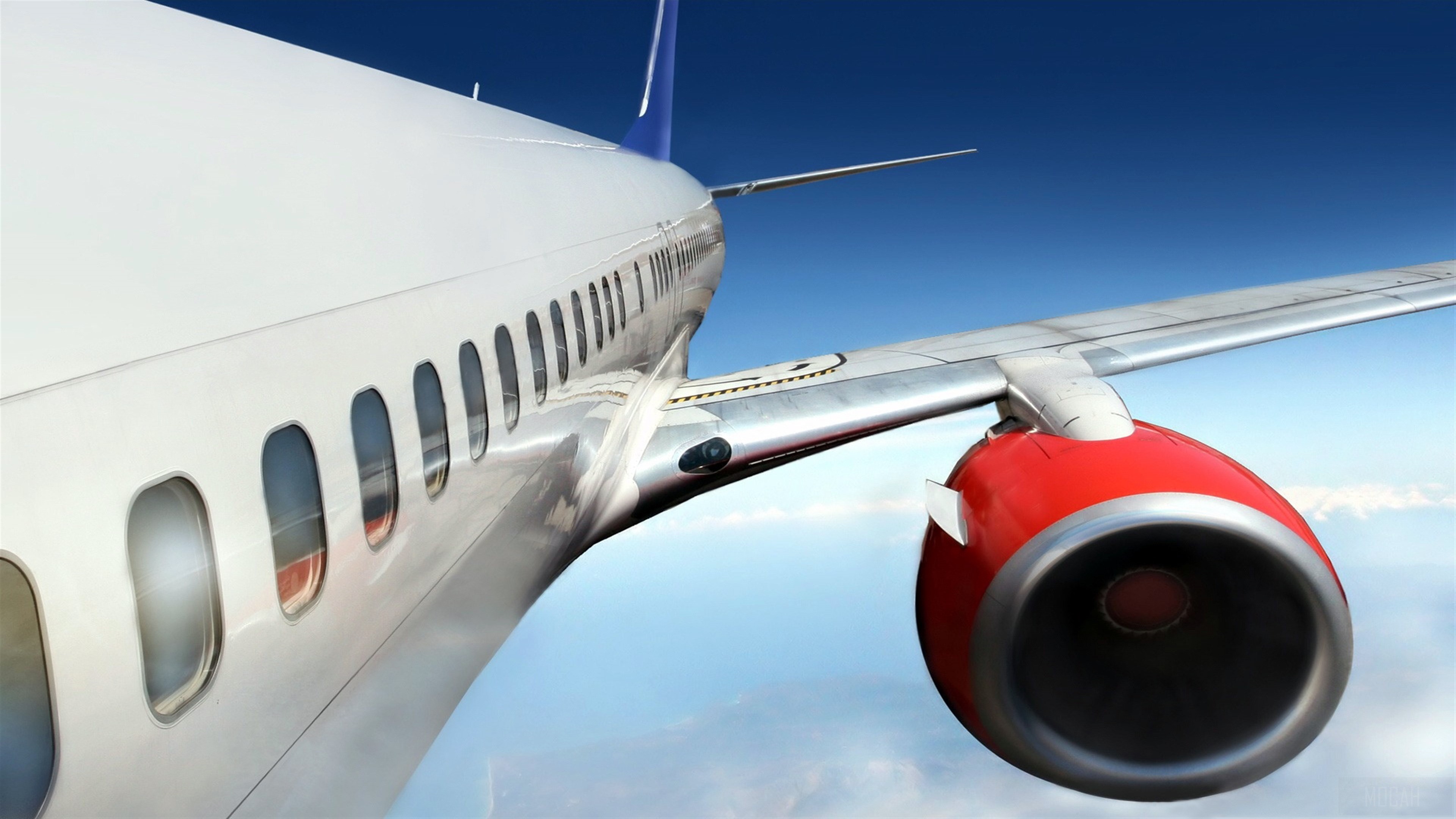 Airplane engine and wing in flight HD Wallpaper