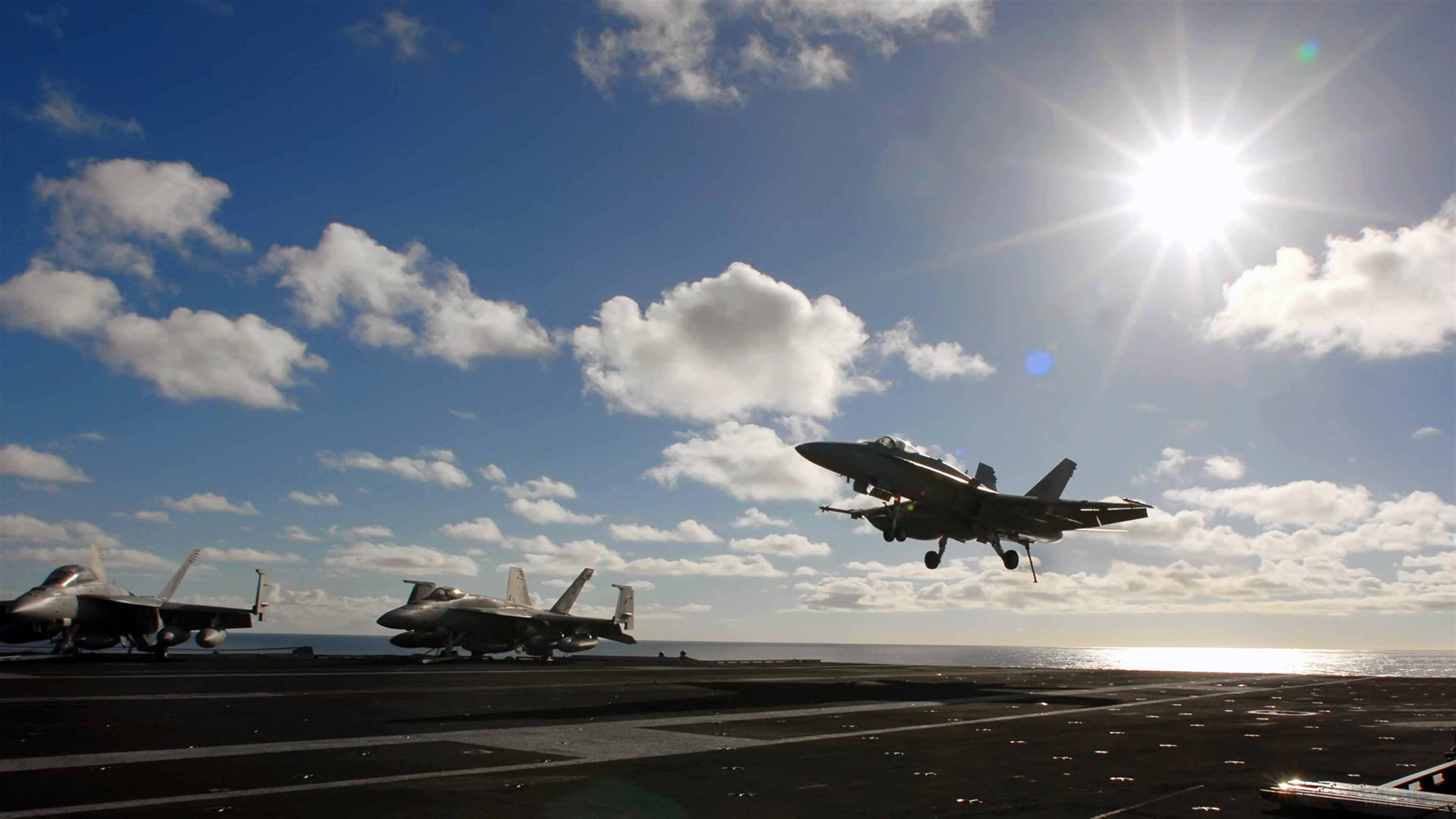 FA-18C Hornet taking off from aircraft carrier HD Wallpaper