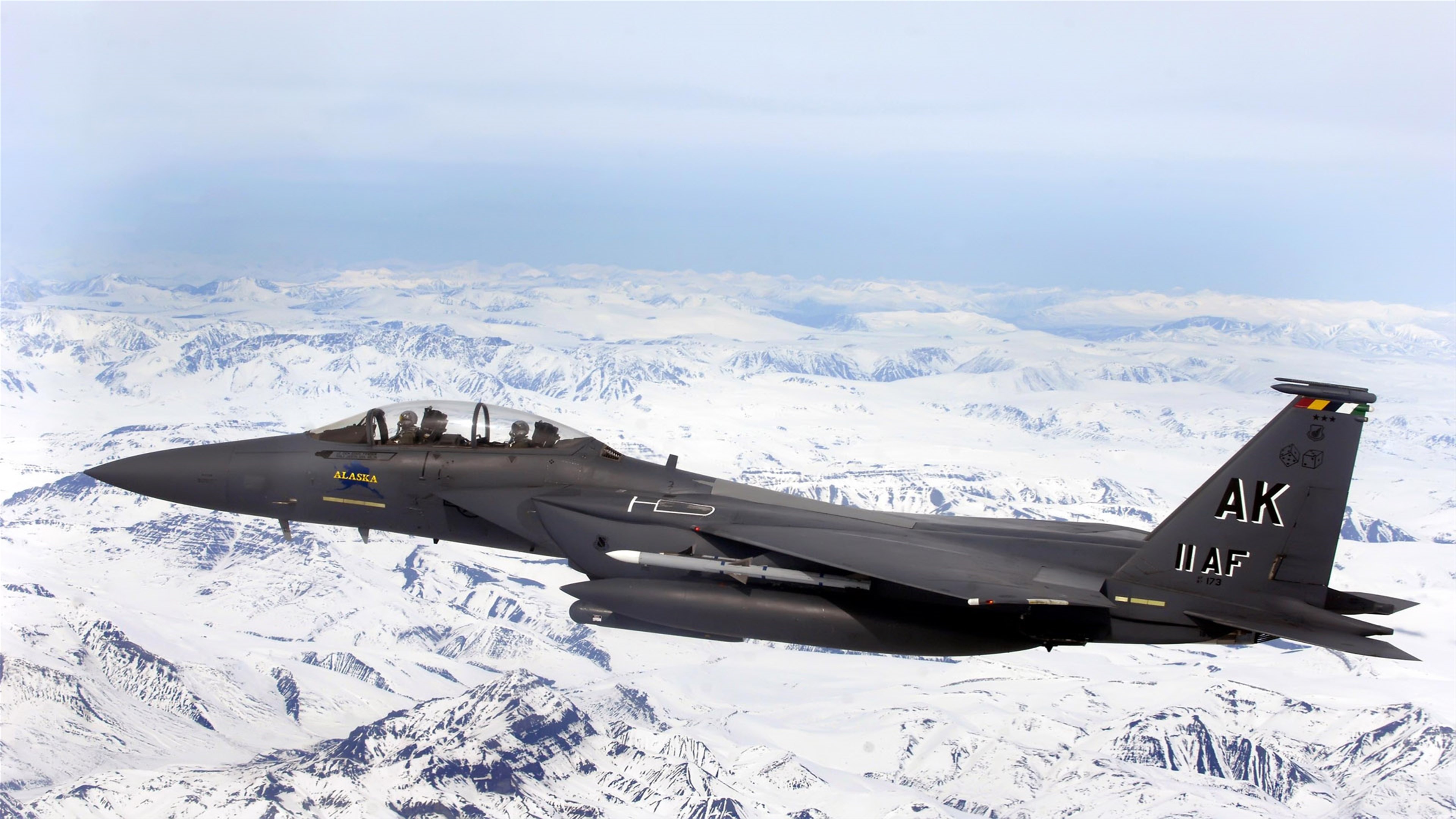F-15E Strike Eagle over snowy mountains 4K HD Wallpaper