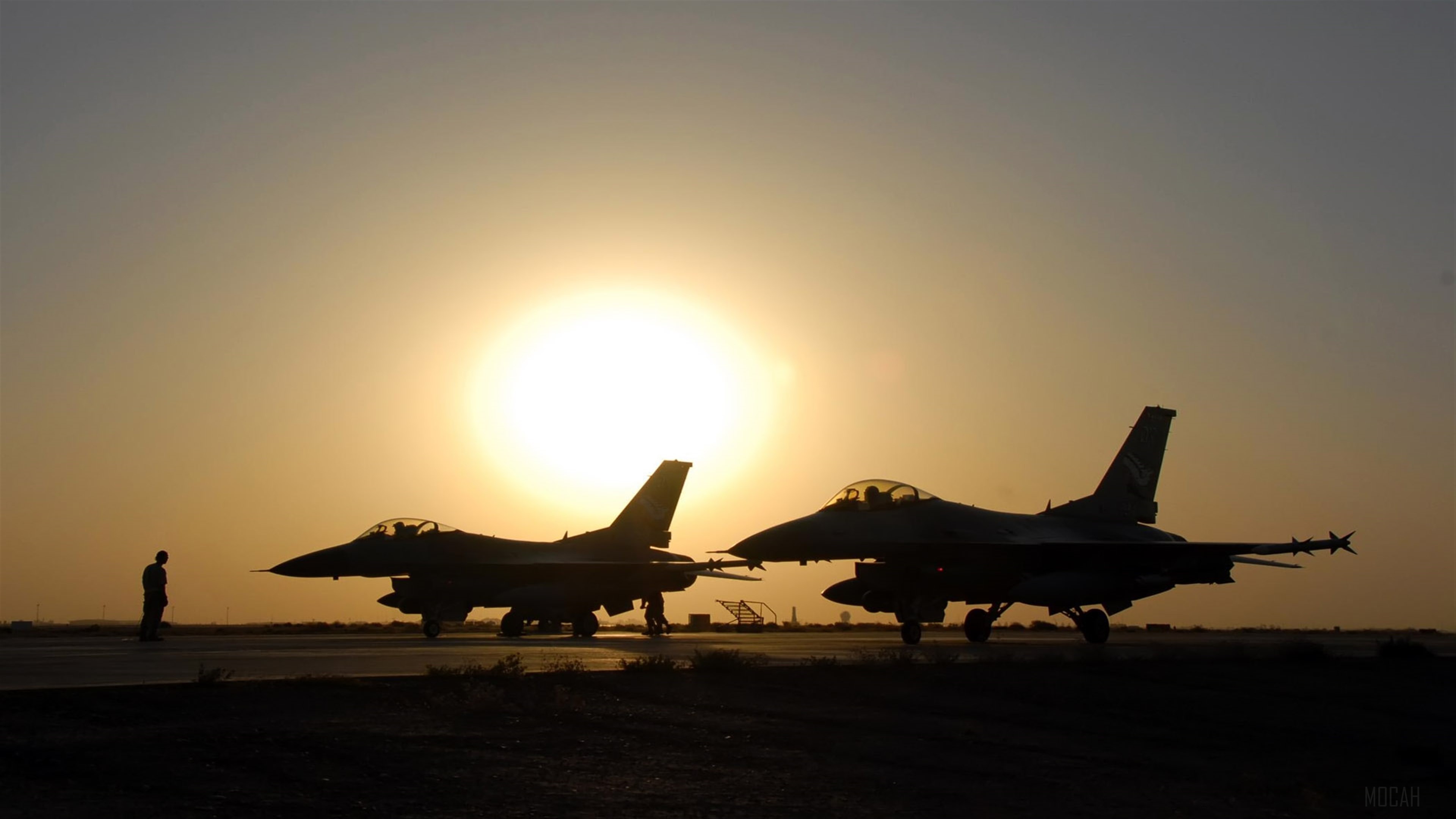 Two F-16 Fighting Falcons at sunset HD Wallpaper