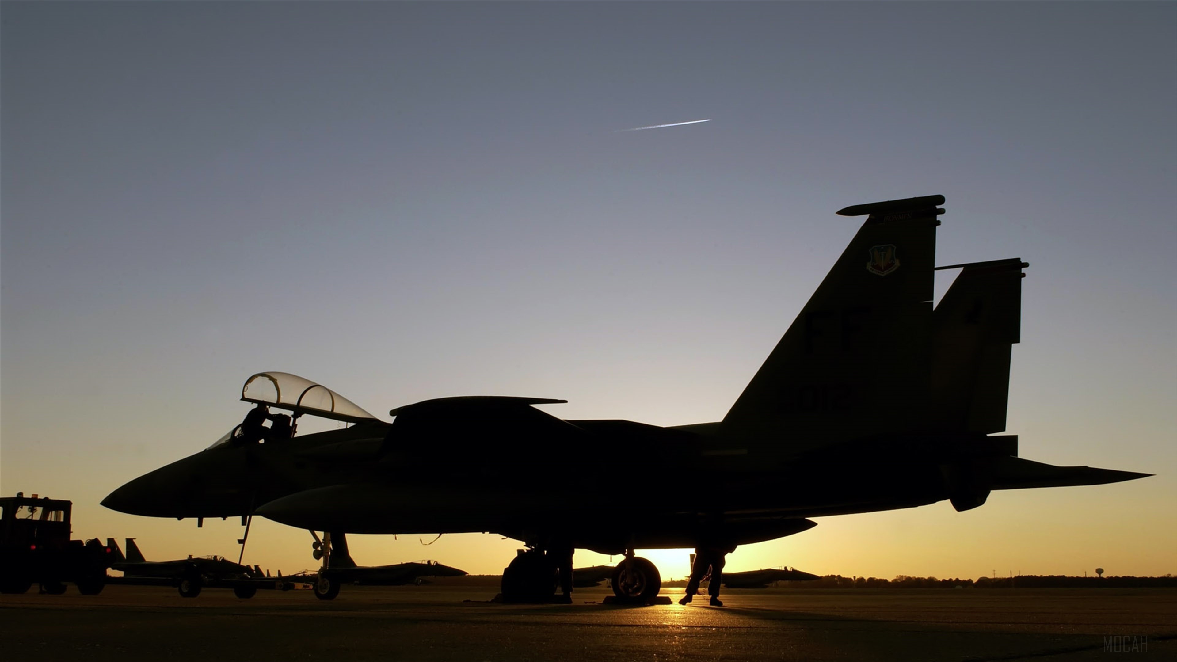 F-15 Eagle fighter jet on tarmac at sunset 4K HD Wallpaper