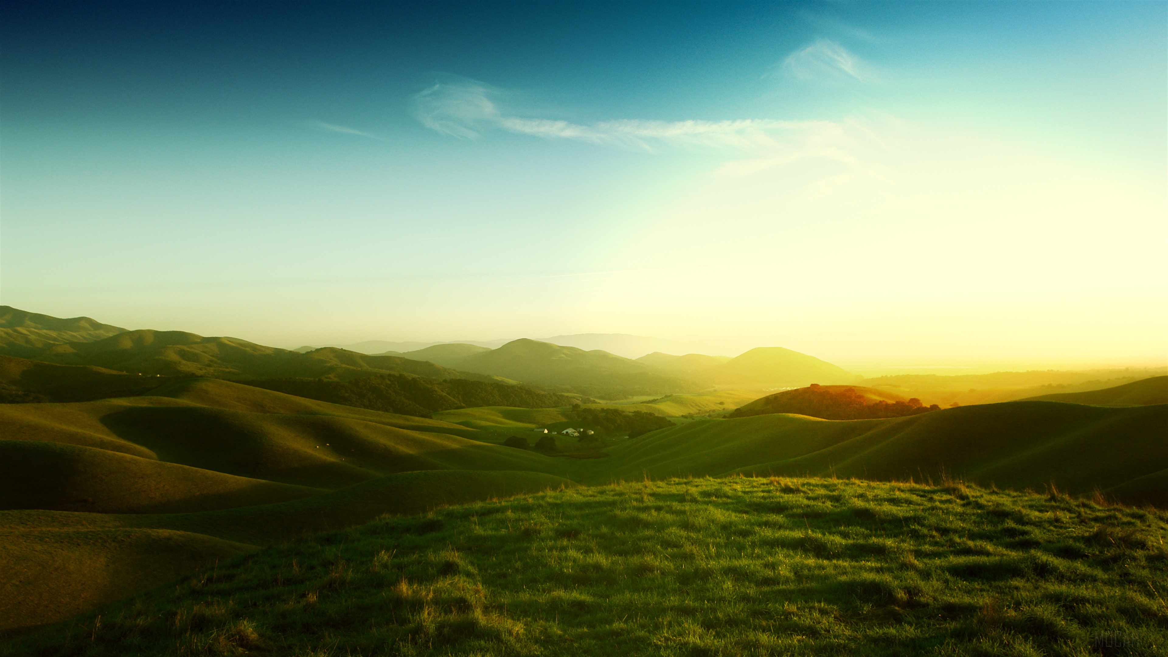 Rolling green hills at sunset 4K HD Wallpaper