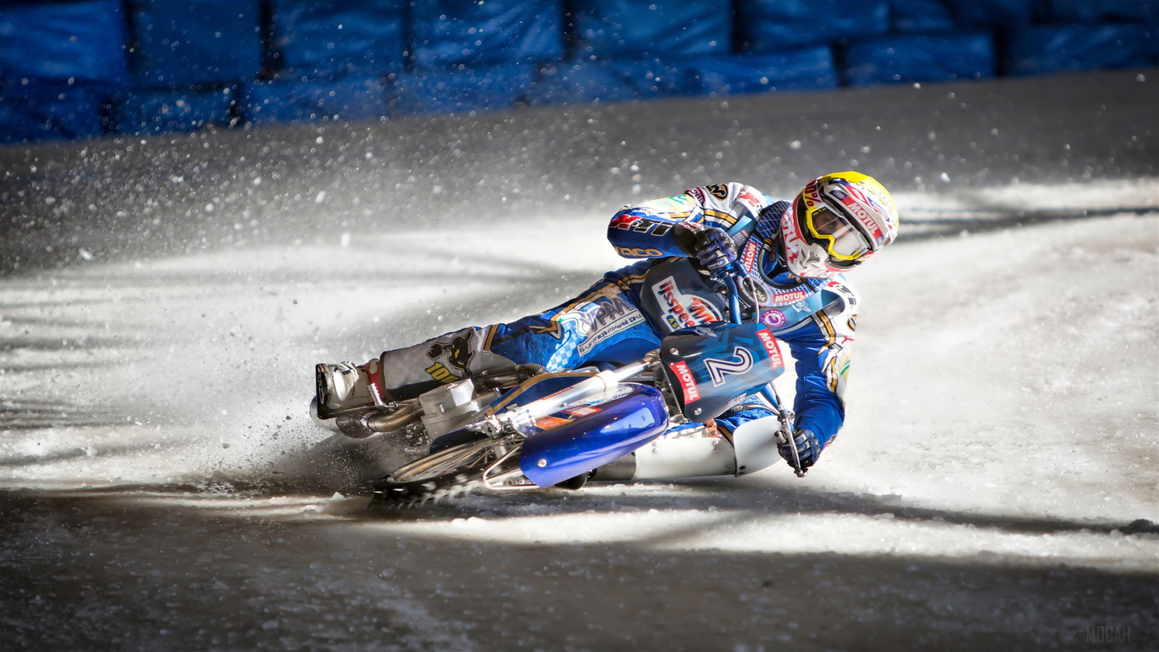 Motorcyclist in a race on a snowy track HD Wallpaper