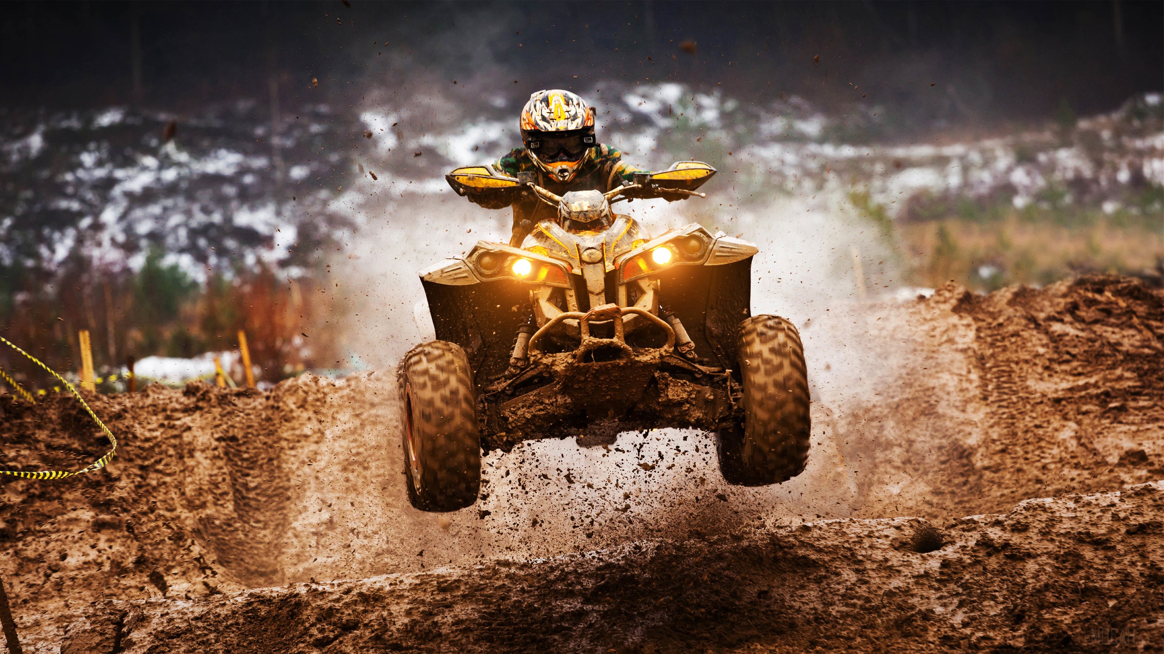 ATV rider jumping over mud in 4K HD Wallpaper