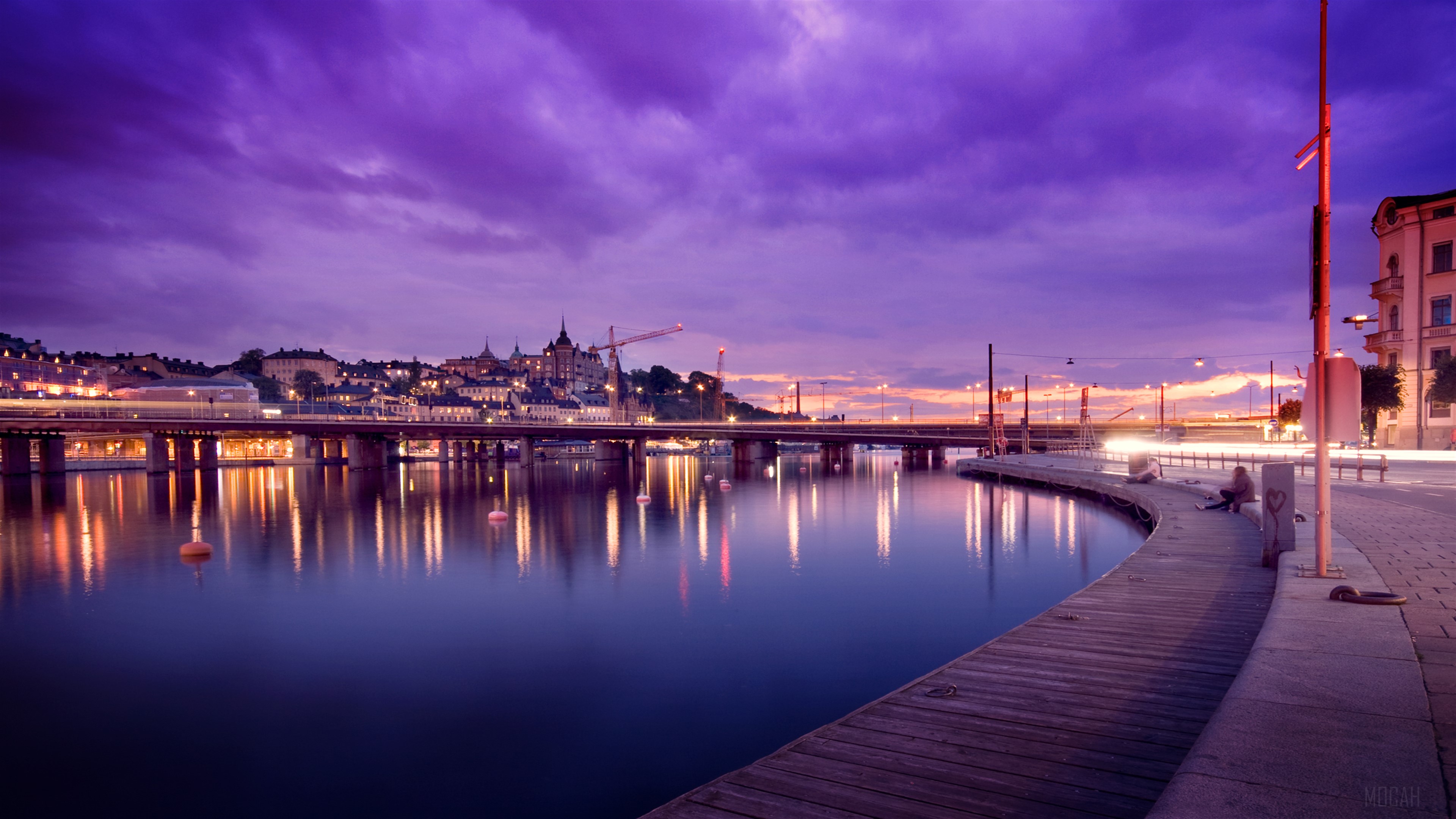 Stockholm Cityscape with Bridge and Water Reflections 4K HD Wallpaper