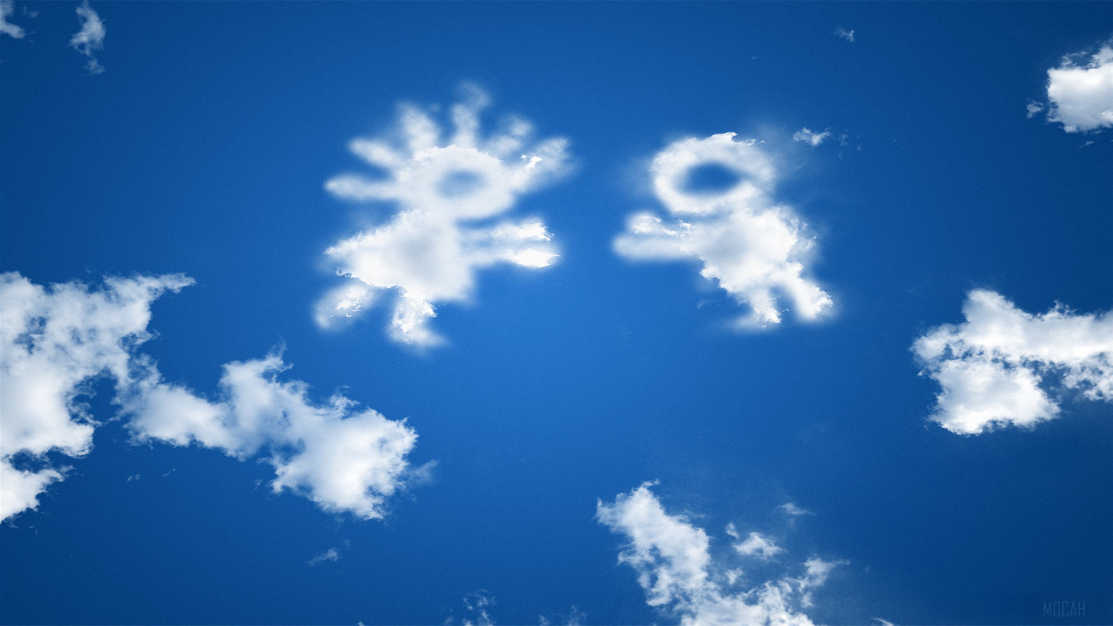 Two cloud figures meeting in a blue sky HD Wallpaper