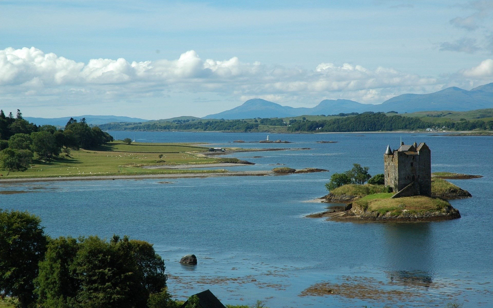 Castle on a small island in a bay with mountains HD Wallpaper