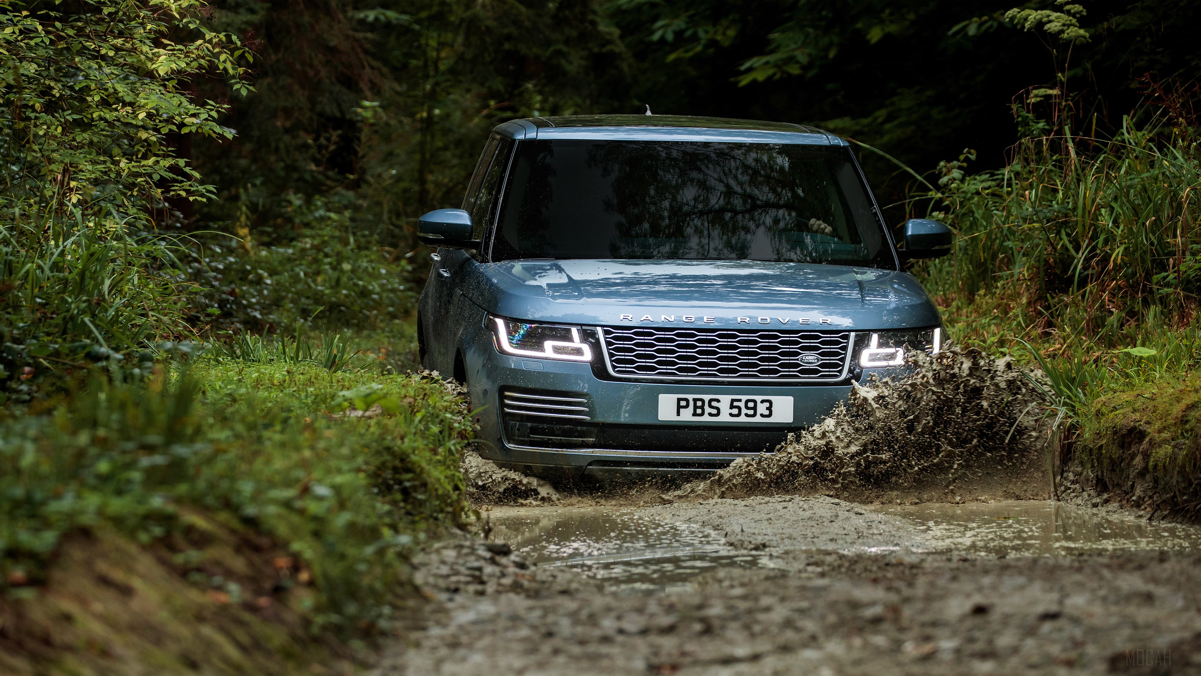 Range Rover Autobiography driving through a muddy forest HD Wallpaper