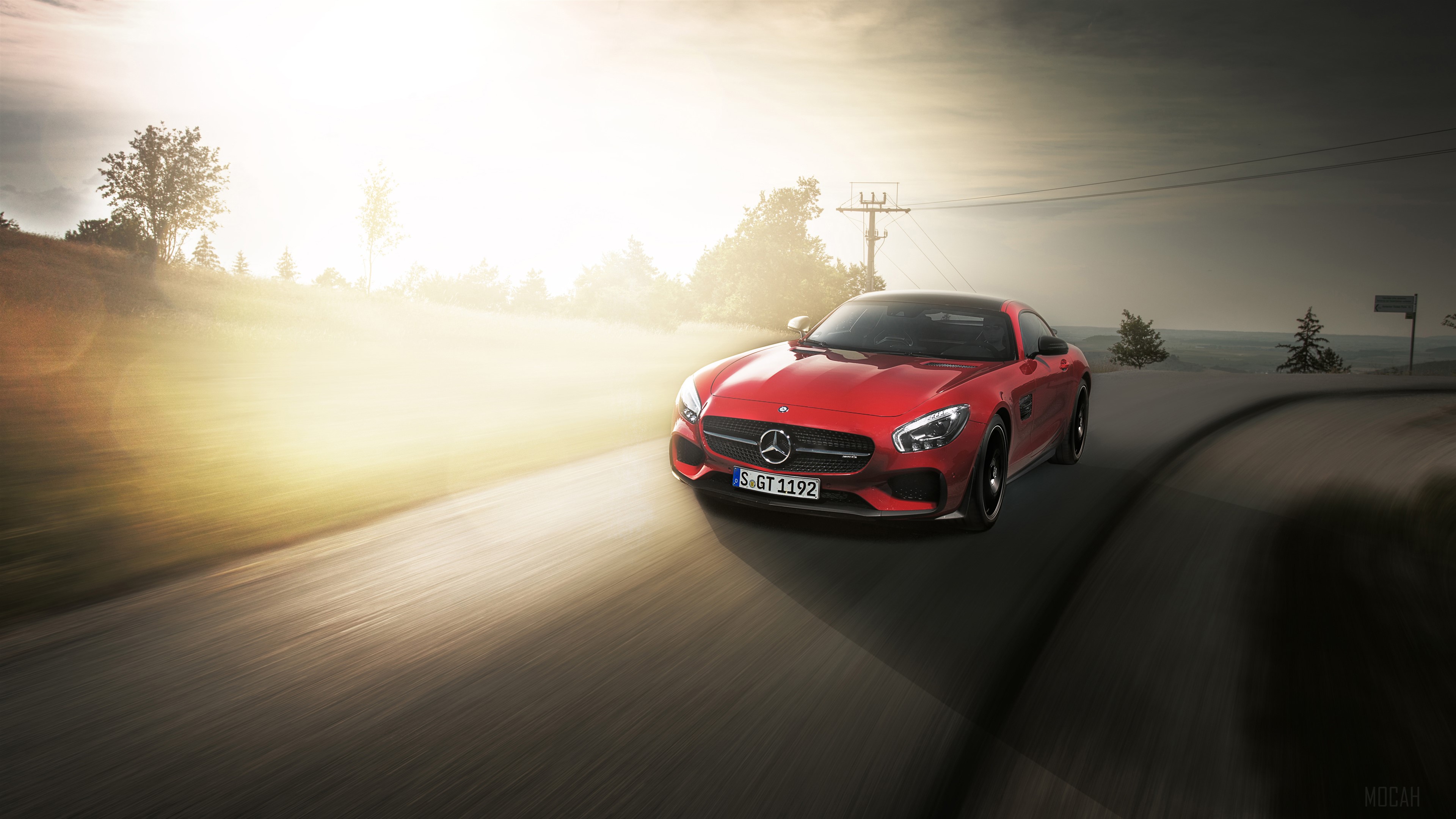 Red Mercedes AMG GTS driving on a road HD Wallpaper