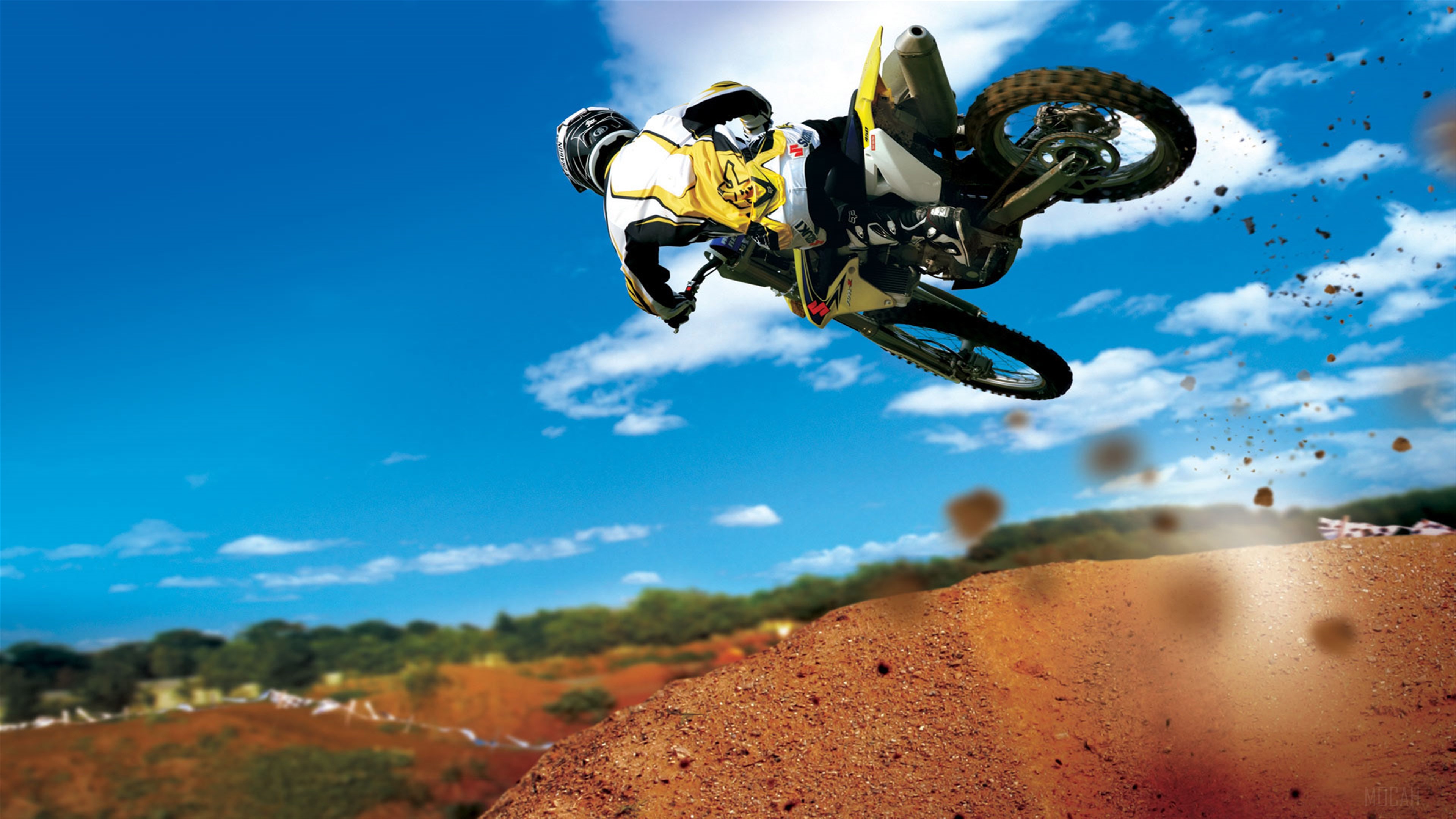 Motocross Rider Performing Stunt in 4K HD Wallpaper