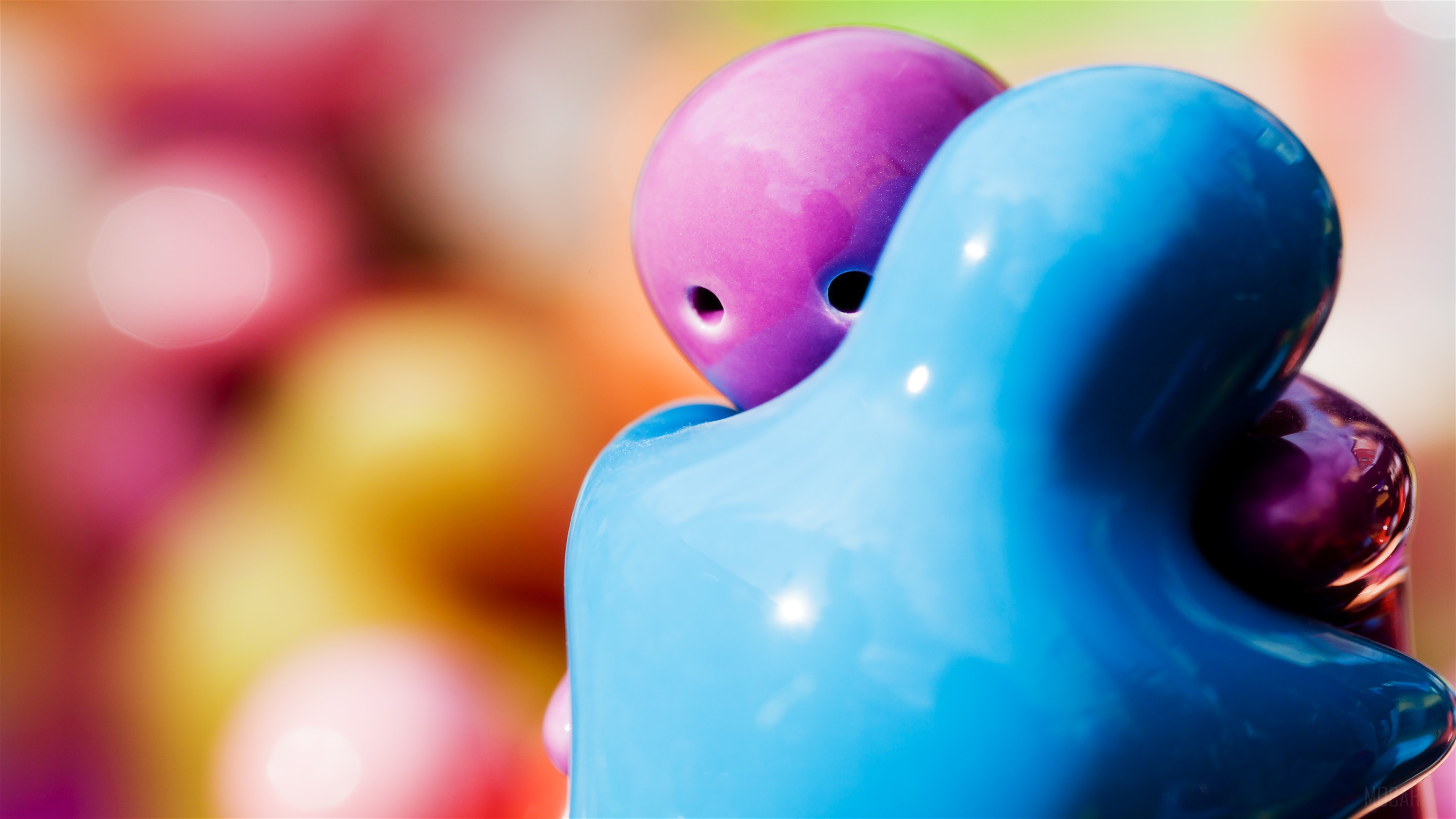Two abstract figures hugging HD Wallpaper