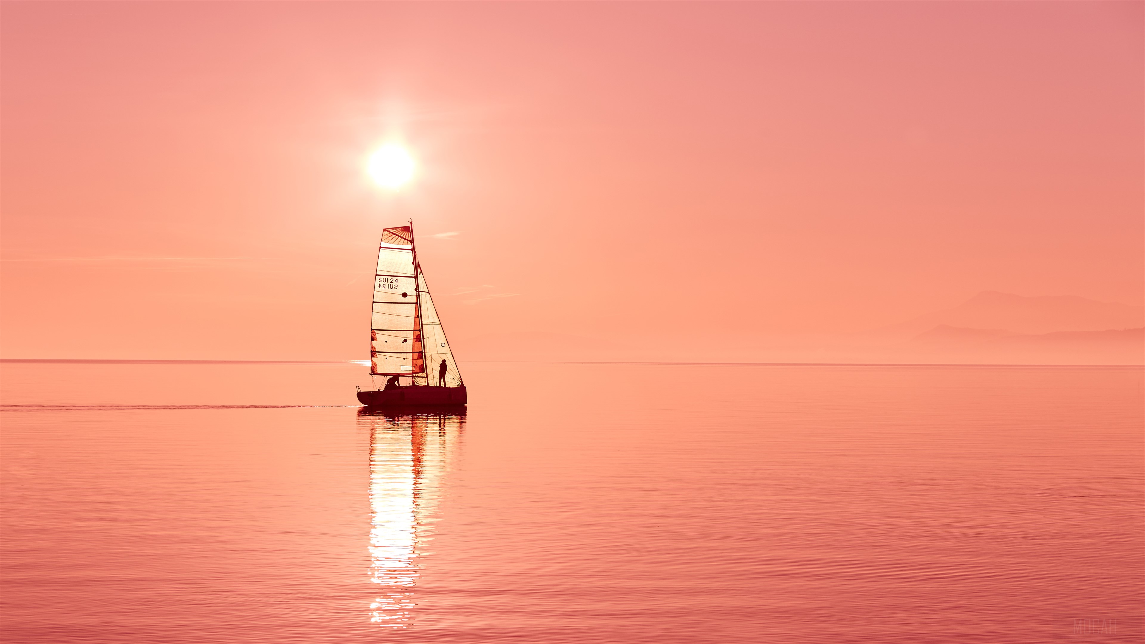 Sailboat on the ocean at sunset 4K HD Wallpaper
