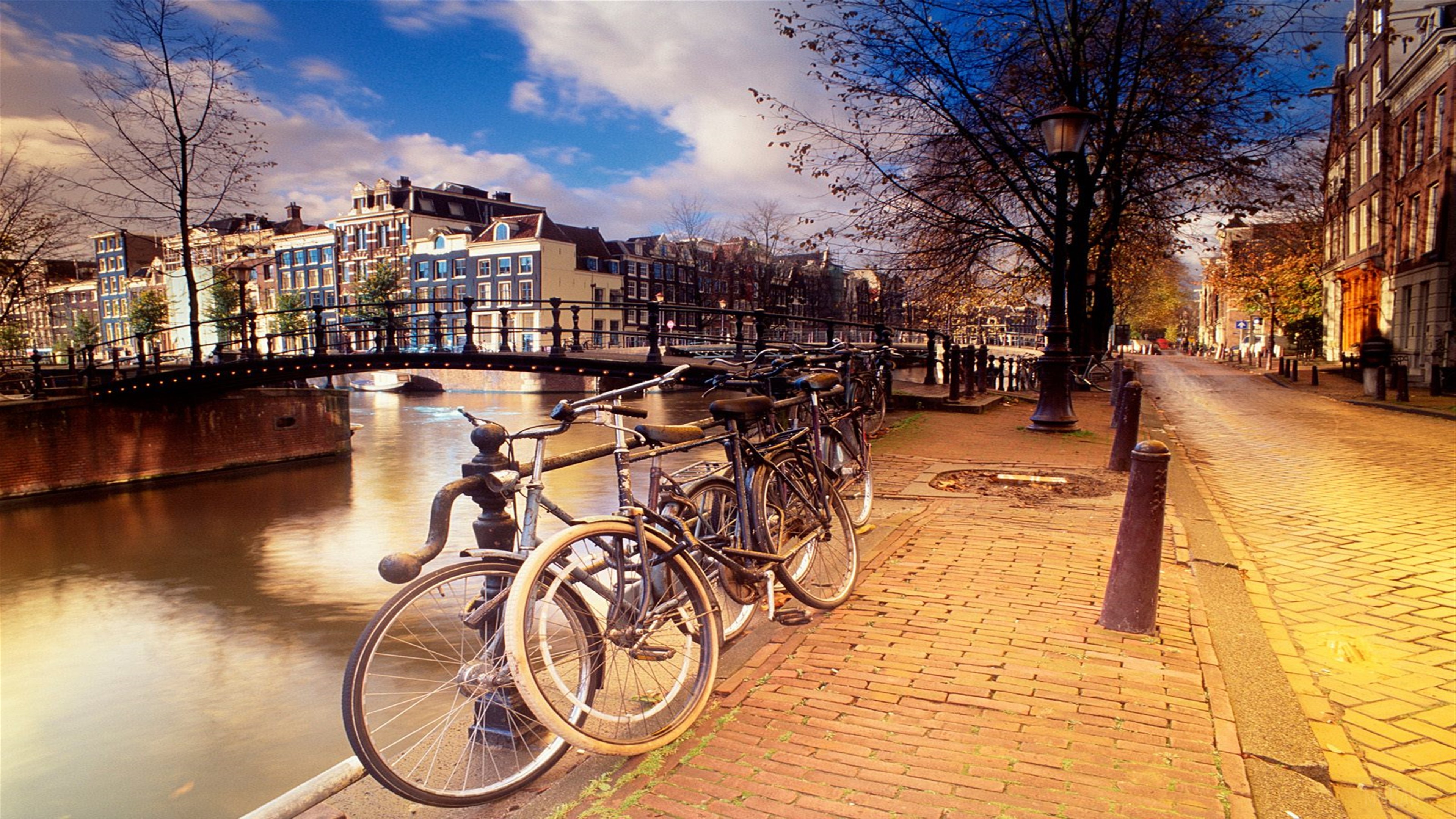 Amsterdam Canal with Bridge and Bicycles in 4K HD Wallpaper