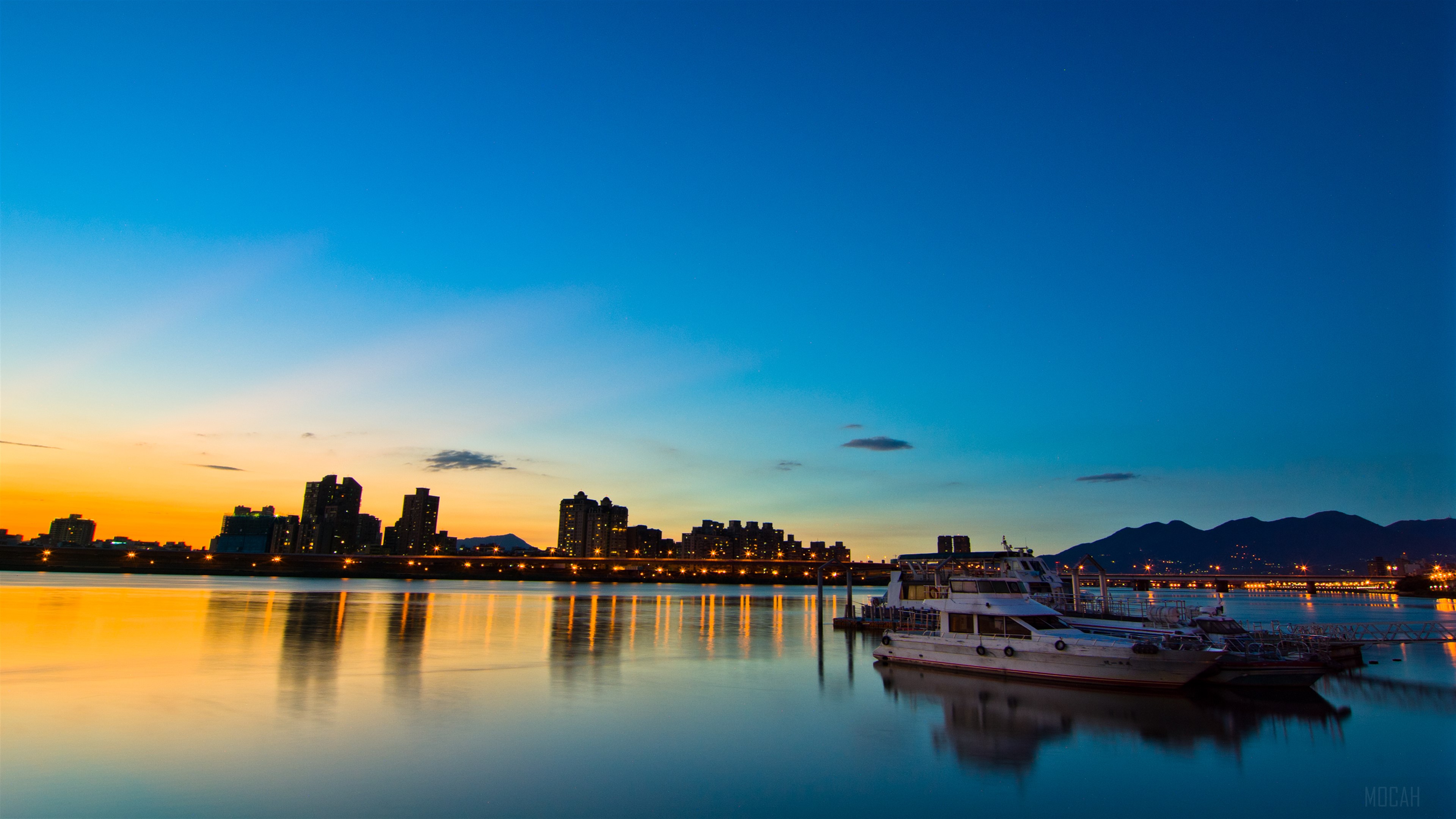 Sunset over Taipei cityscape with boats HD Wallpaper