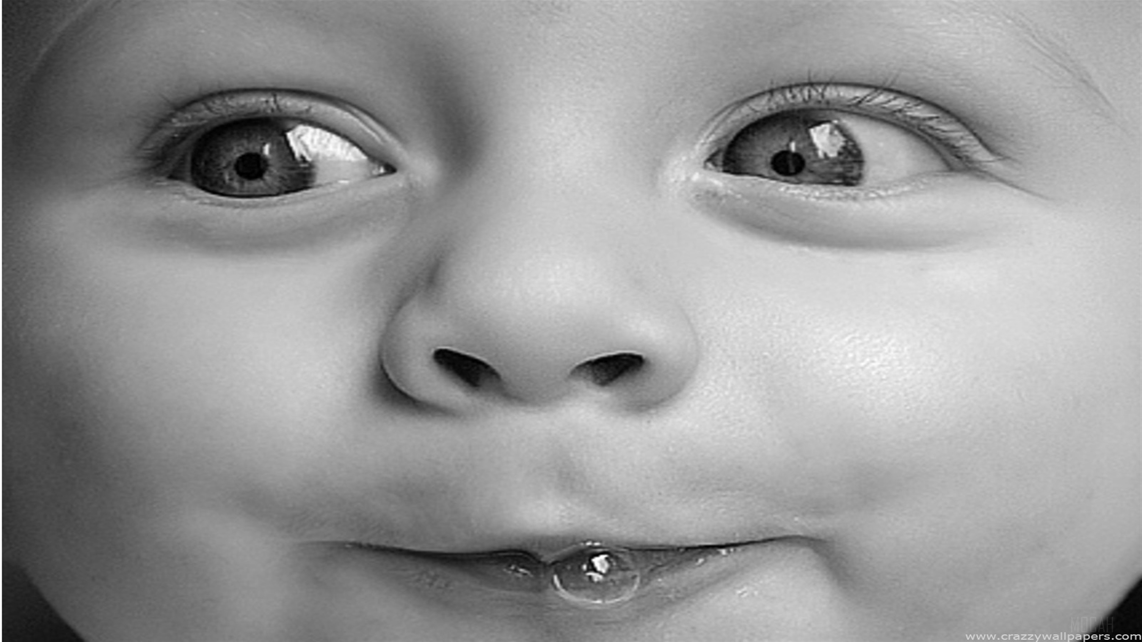 Close-up of a baby's face with a bubble HD Wallpaper