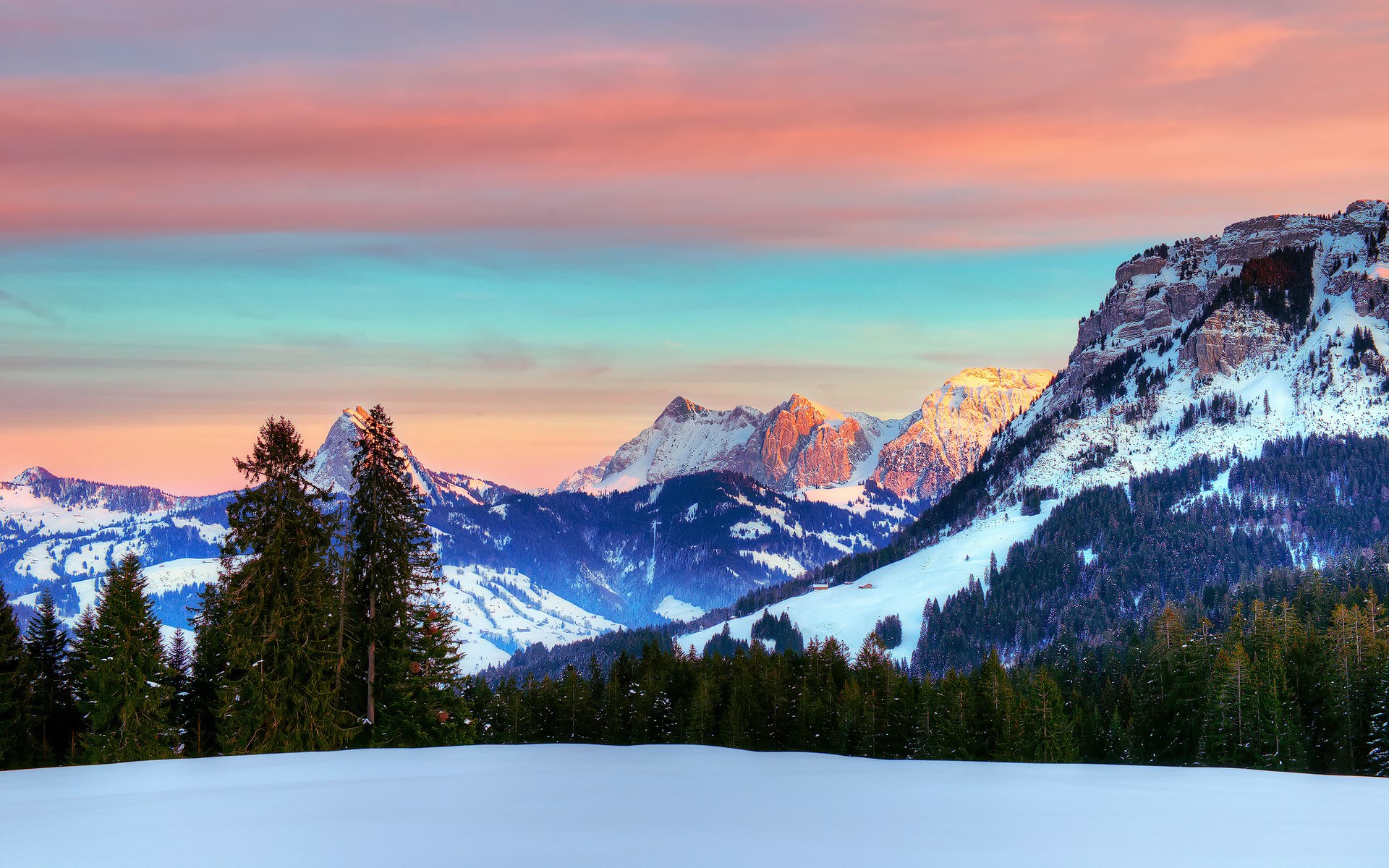 Snowy mountains at sunset with colorful sky HD Wallpaper