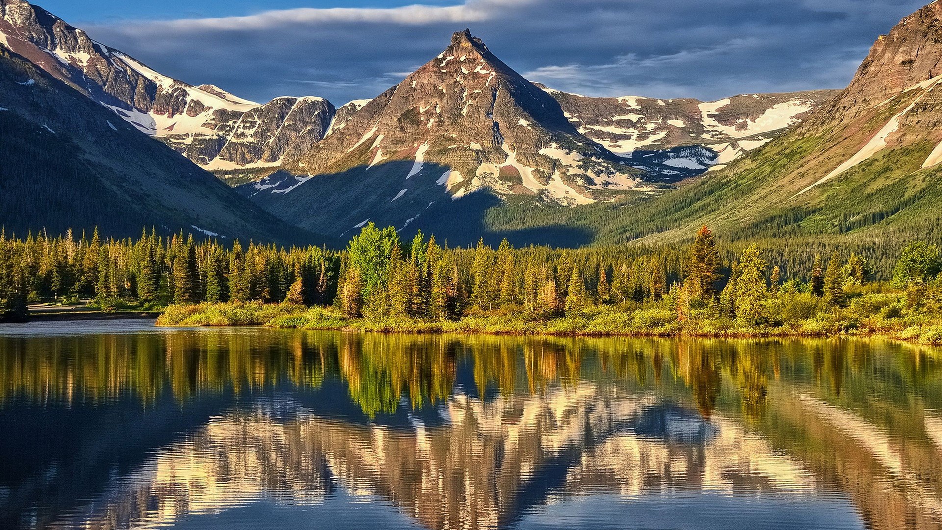 Mountain lake with reflection of snow-capped mountains and pine forest HD Wallpaper