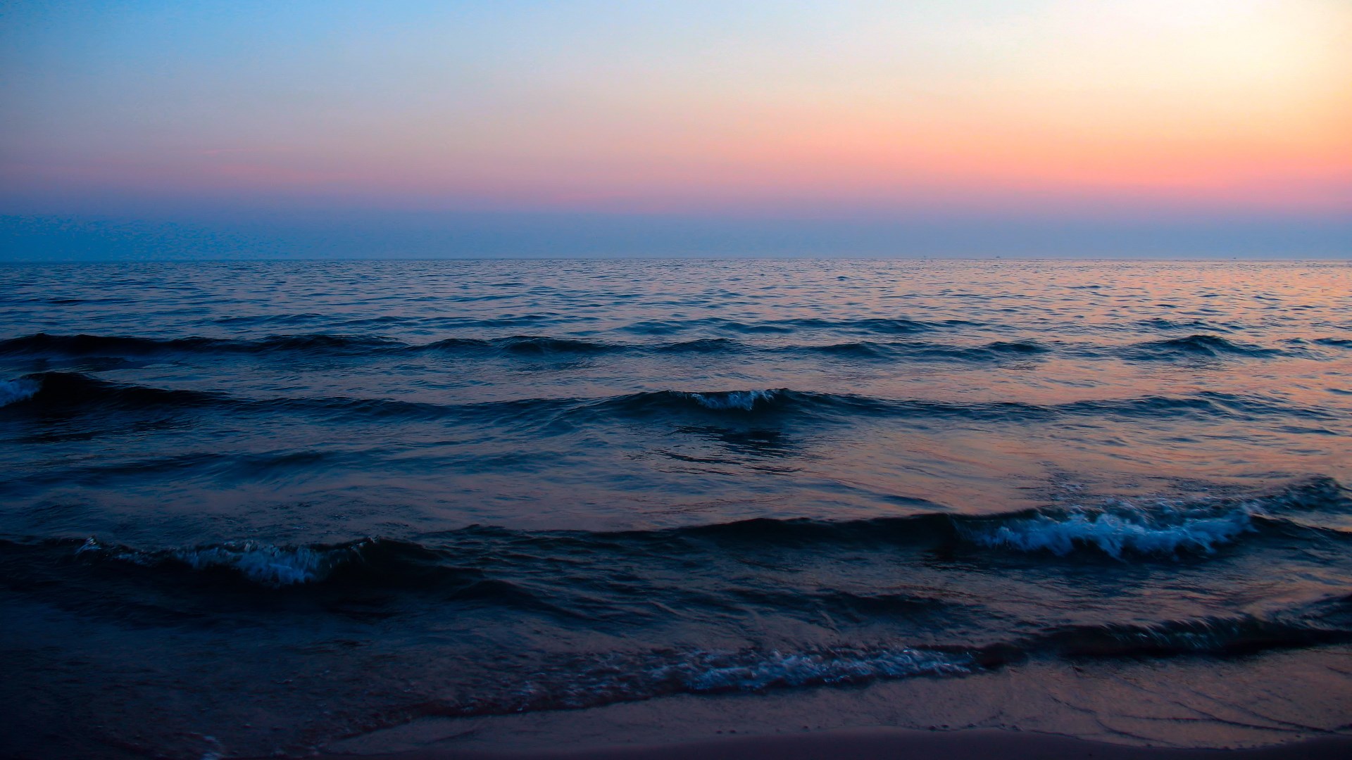 Ocean waves at sunset with colorful sky HD Wallpaper