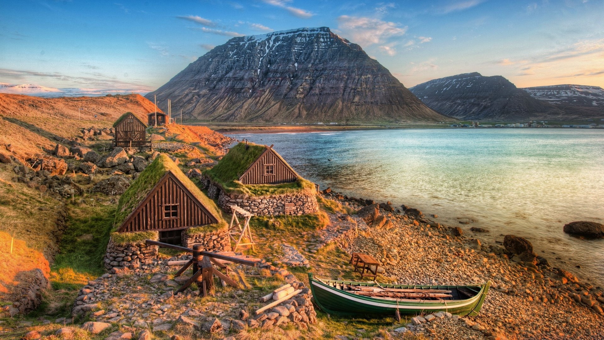Traditional turf-roofed houses by a fjord in Iceland HD Wallpaper