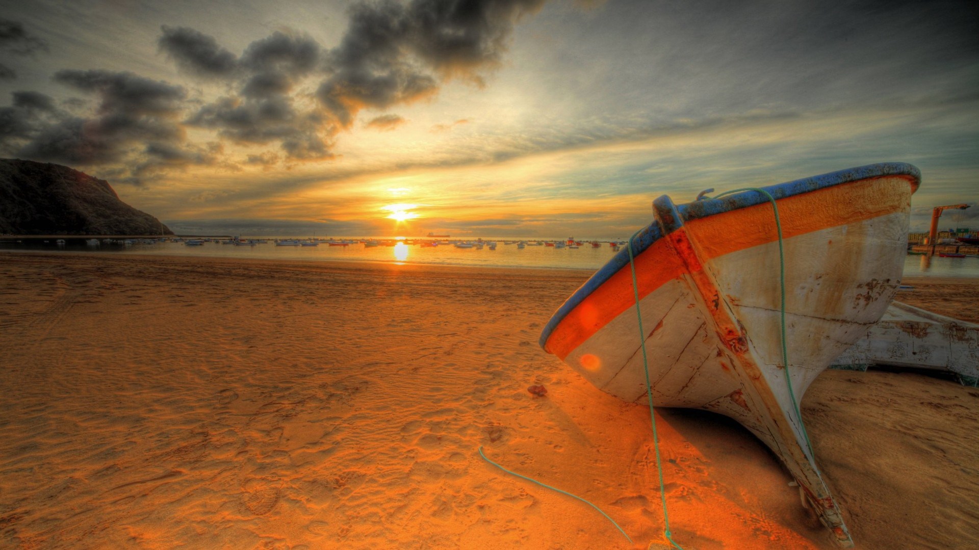 Boat on a beach at sunset HD Wallpaper