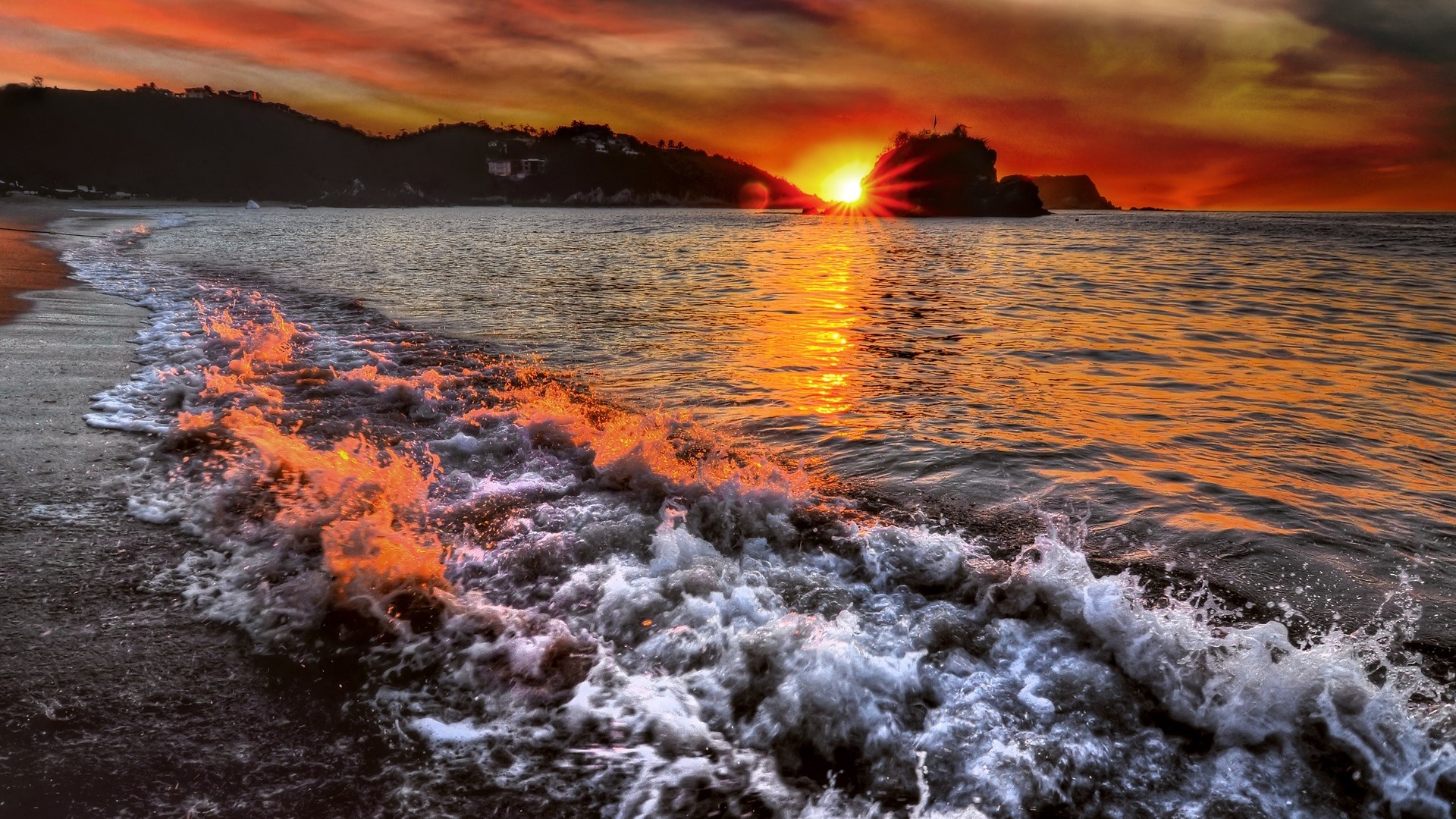Sunset over a tropical beach with waves HD Wallpaper