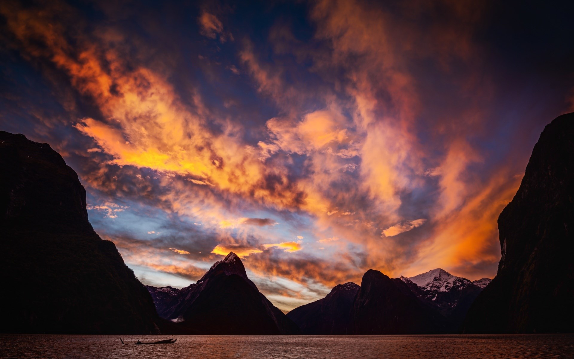 Fiordland National Park at sunset with dramatic clouds HD Wallpaper