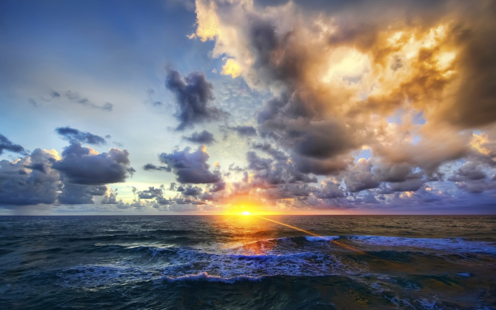 Sunset over the ocean with dramatic clouds HD Wallpaper