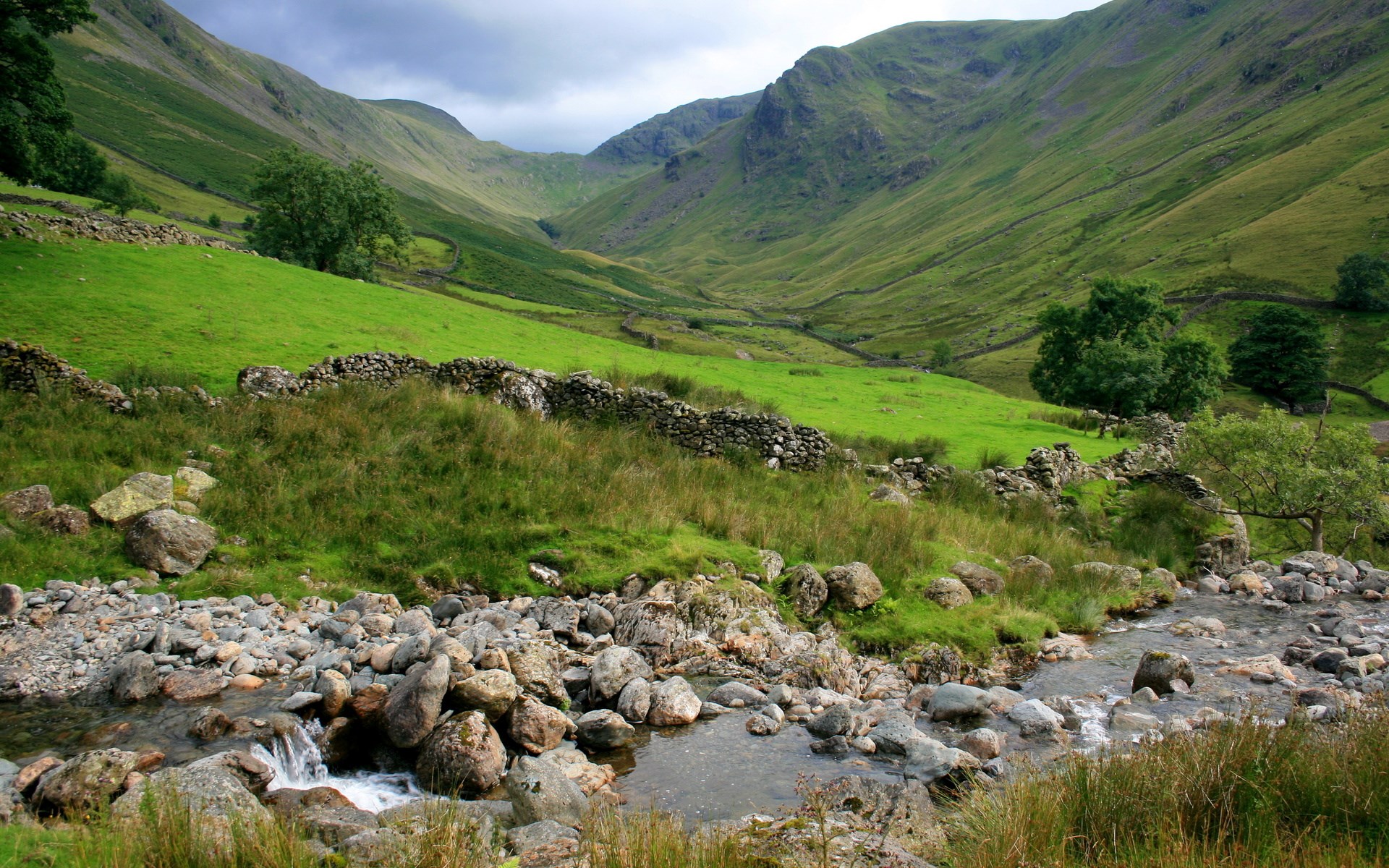 Valley with stream and stone walls HD Wallpaper