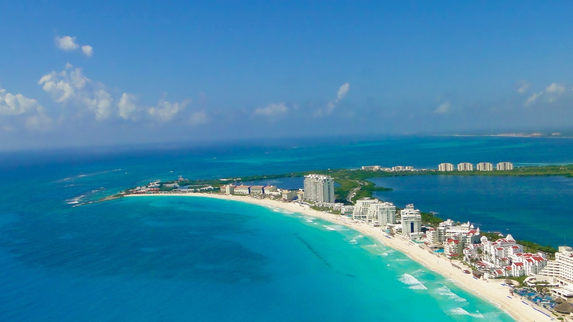 Aerial view of Cancun coastline with resorts and turquoise waters HD Wallpaper