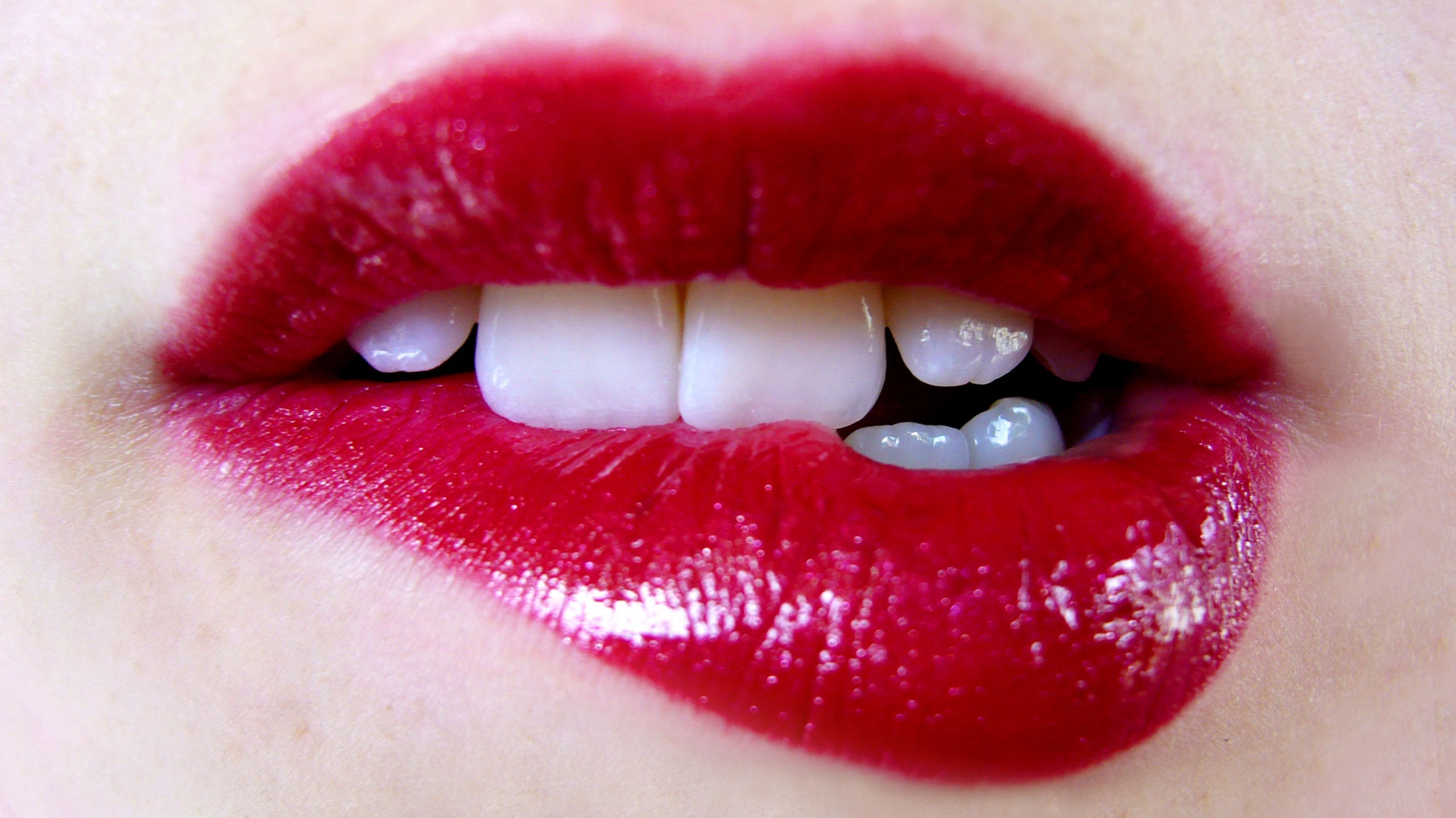Close-up of red lips biting teeth HD Wallpaper