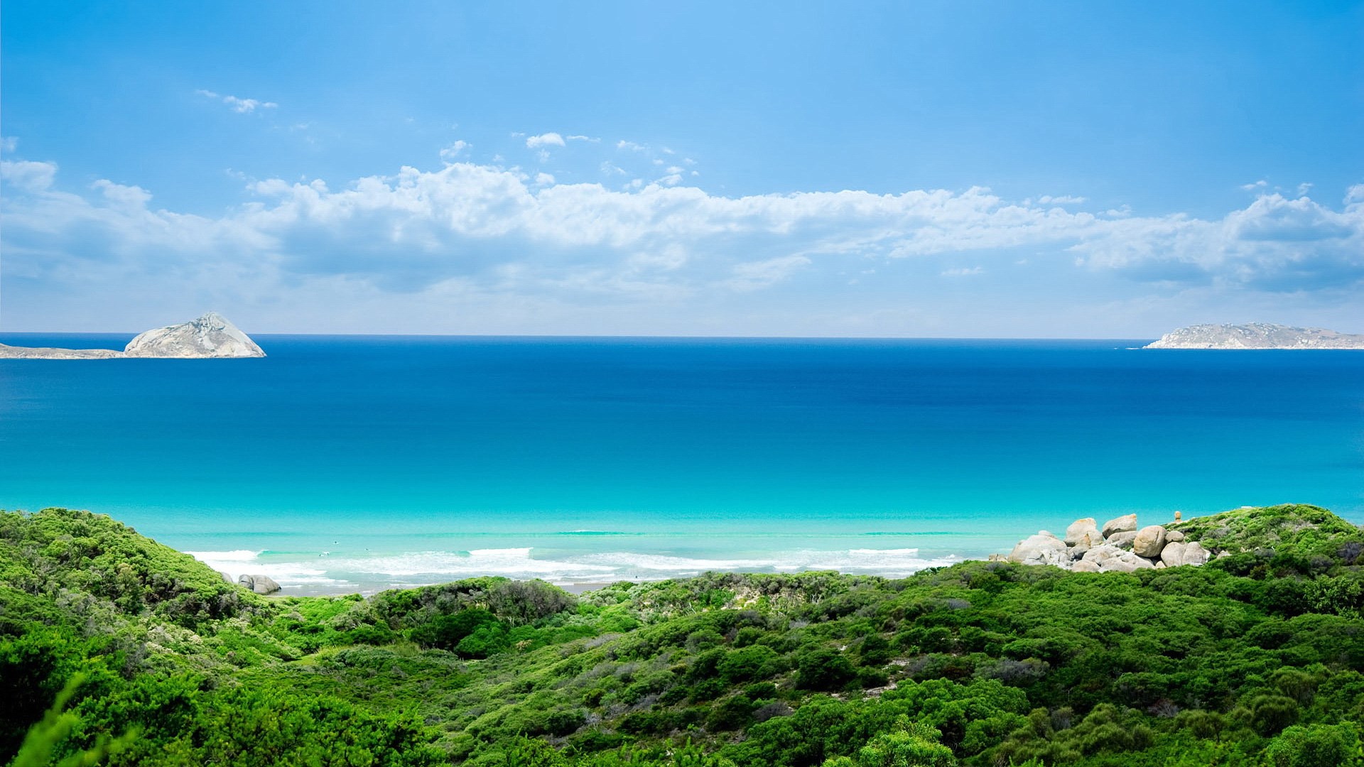 Ocean view with islands and green hills HD Wallpaper