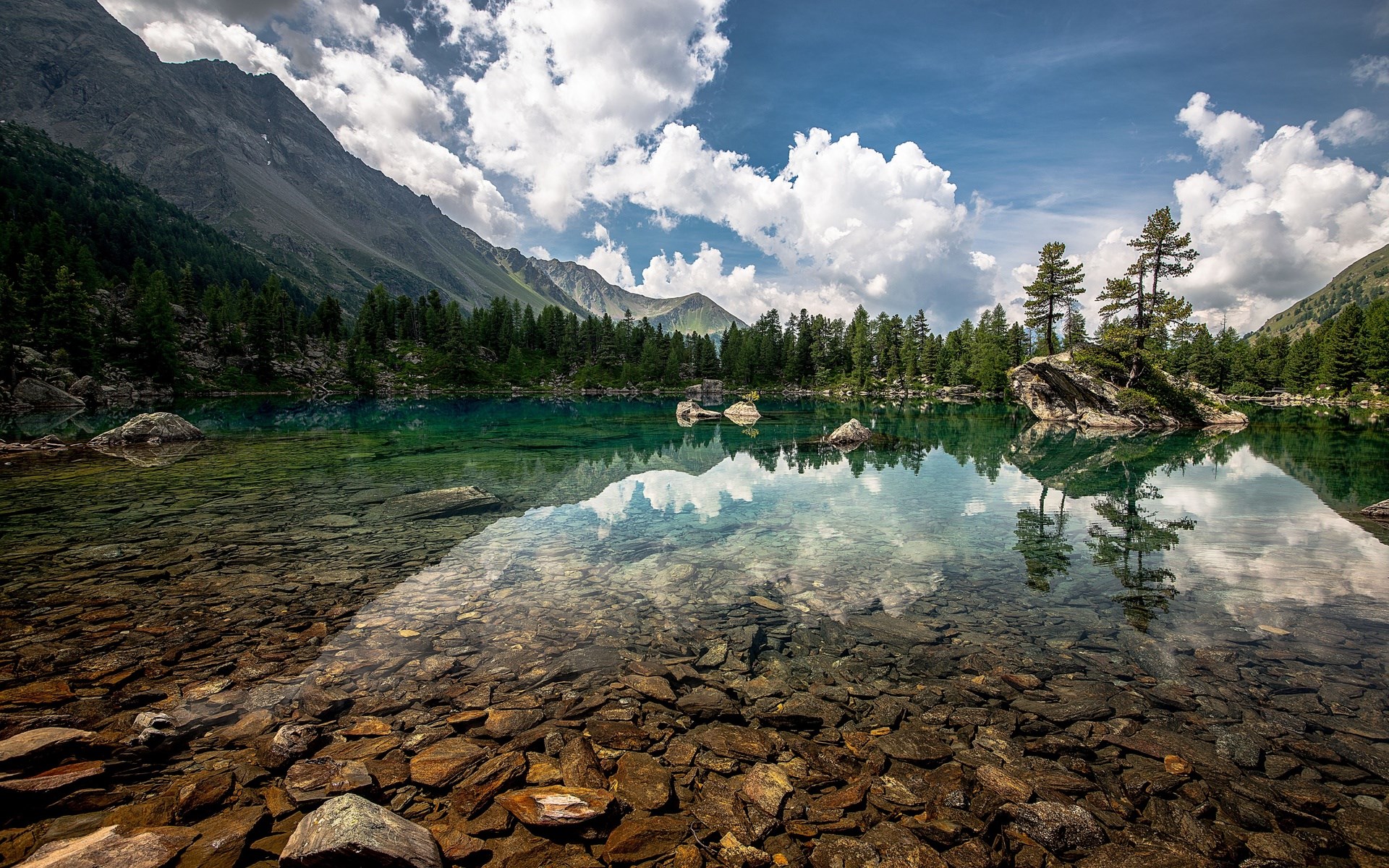 Mountain lake with clear water and rocky shore HD Wallpaper