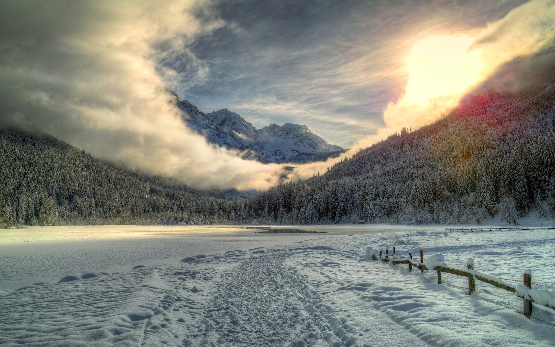 Snowy mountain landscape with sun and clouds HD Wallpaper