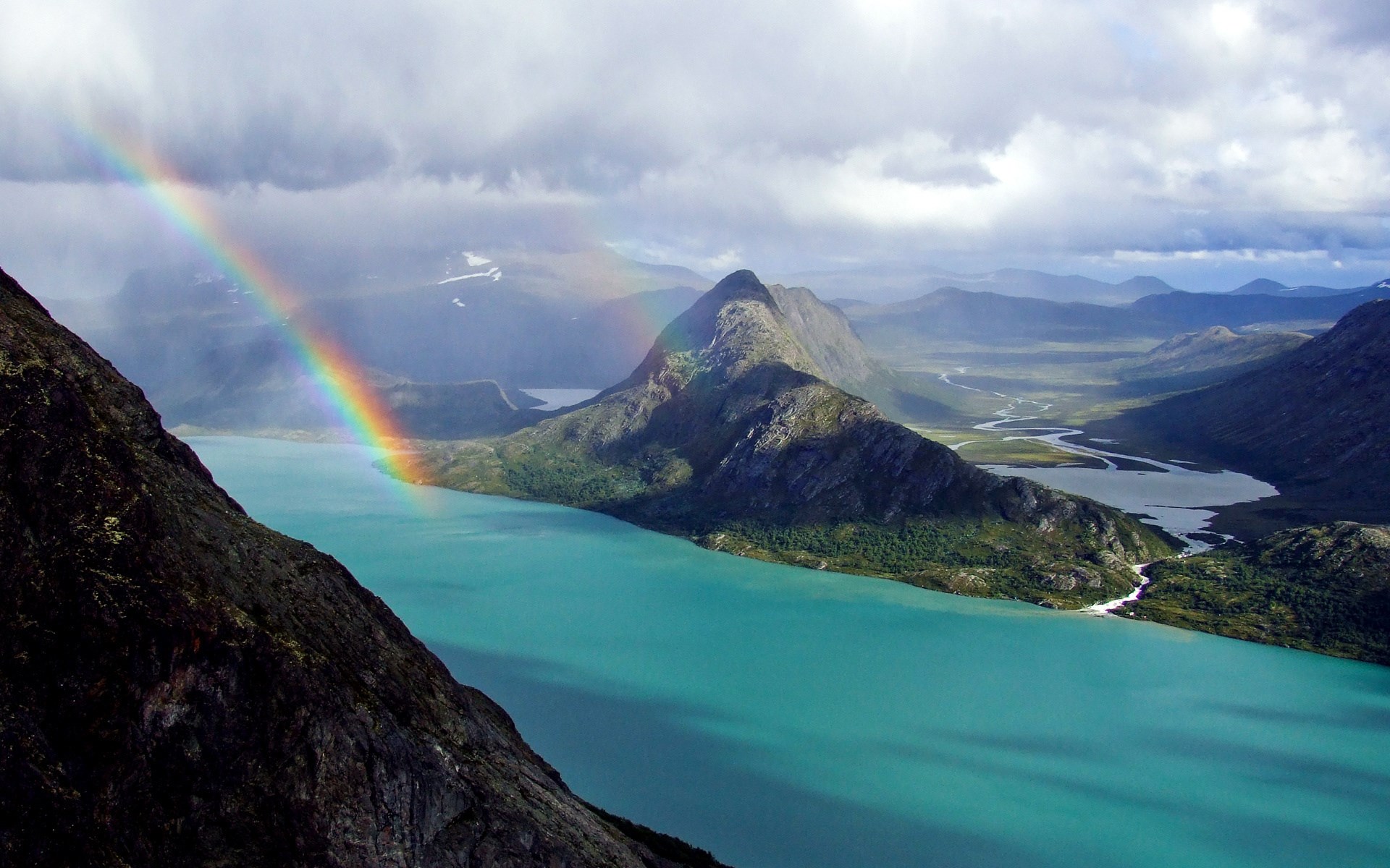Rainbow over a turquoise lake and mountains HD Wallpaper