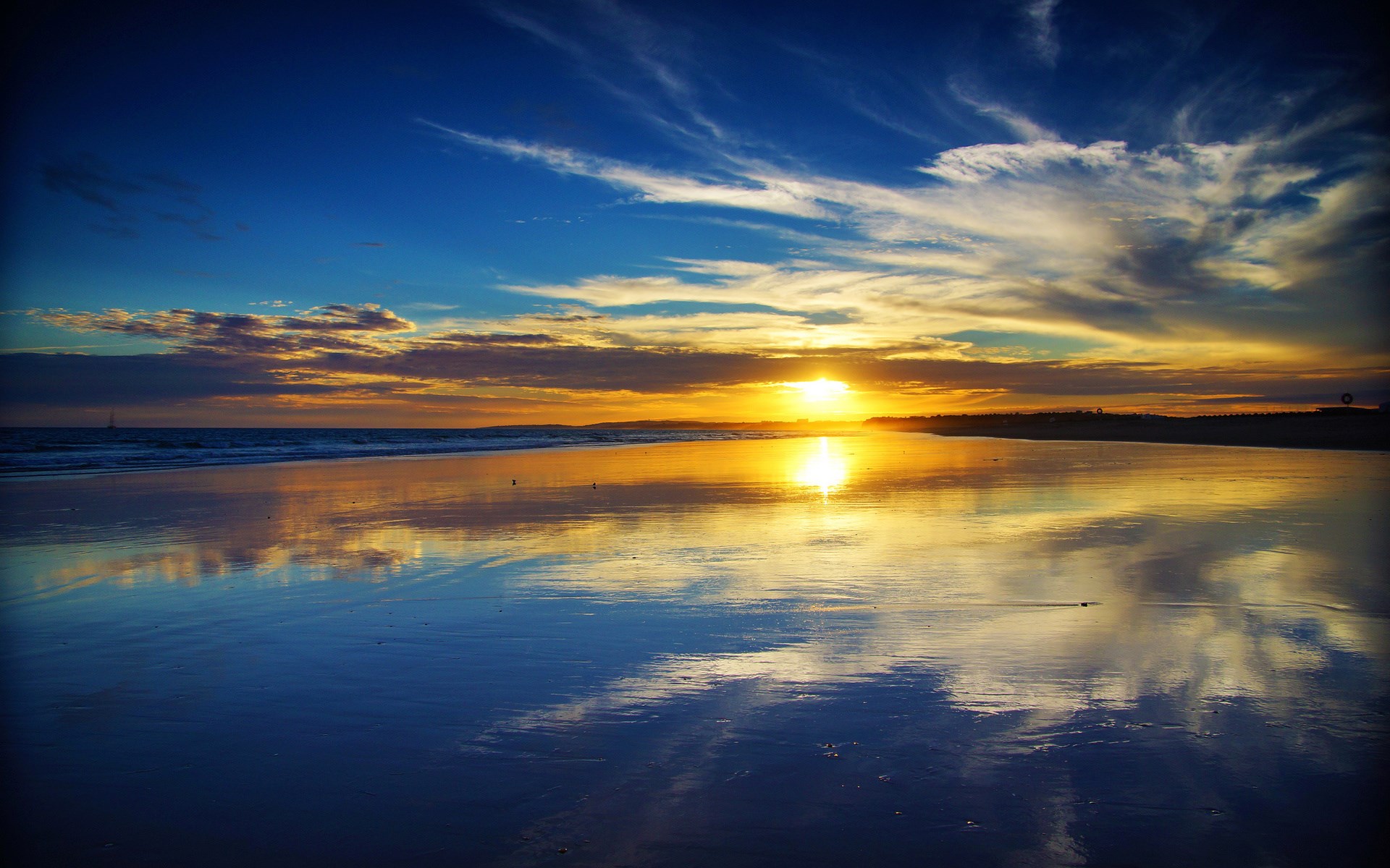 Sunset over a beach with reflections HD Wallpaper