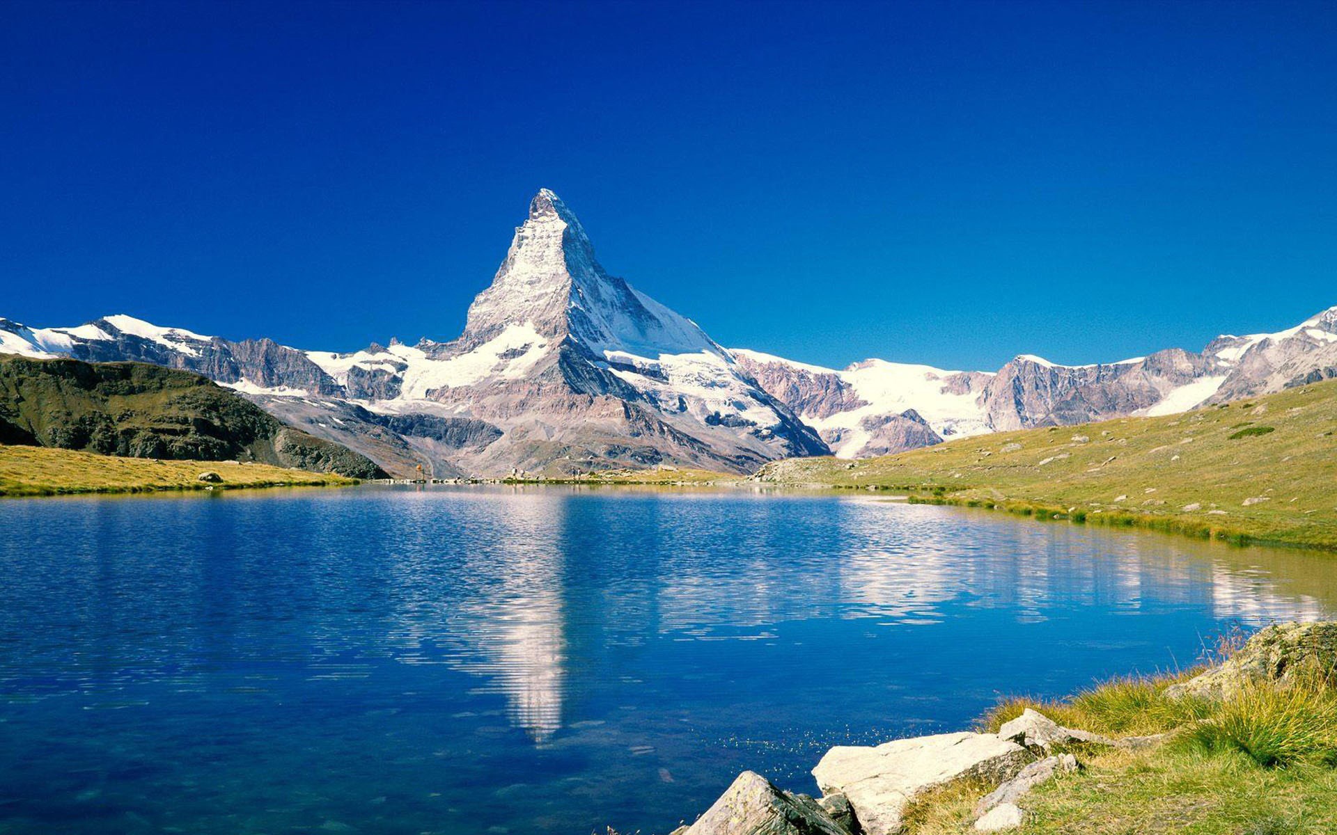 Matterhorn mountain reflected in a lake HD Wallpaper