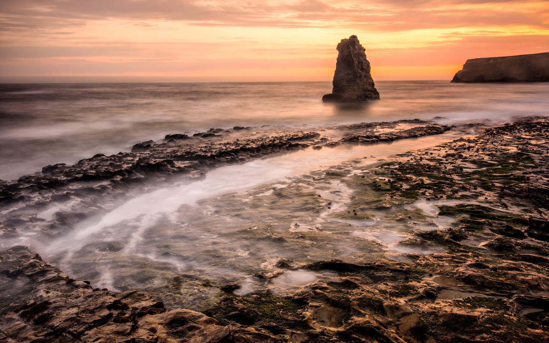 Rocky coastline with sea stacks at sunset HD Wallpaper
