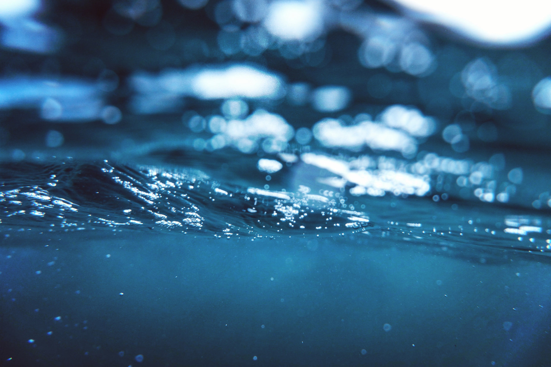 Blue water surface with light reflections HD Wallpaper