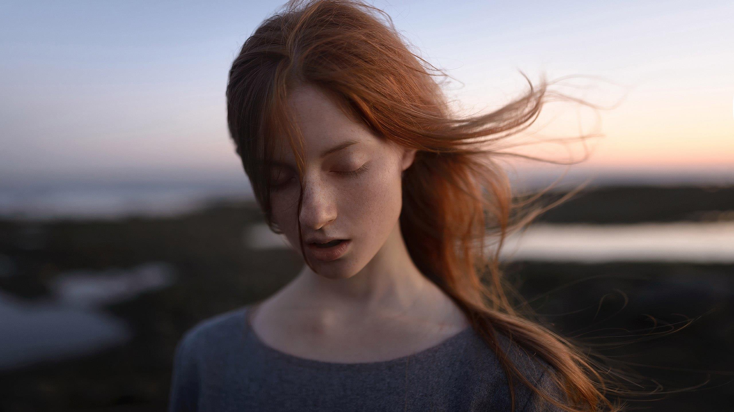 Redhead woman with eyes closed outdoors HD Wallpaper