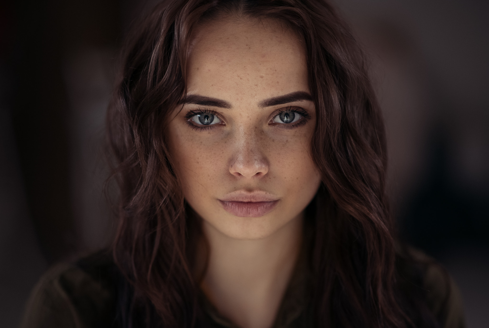 Portrait of a young woman with freckles and gray eyes HD Wallpaper