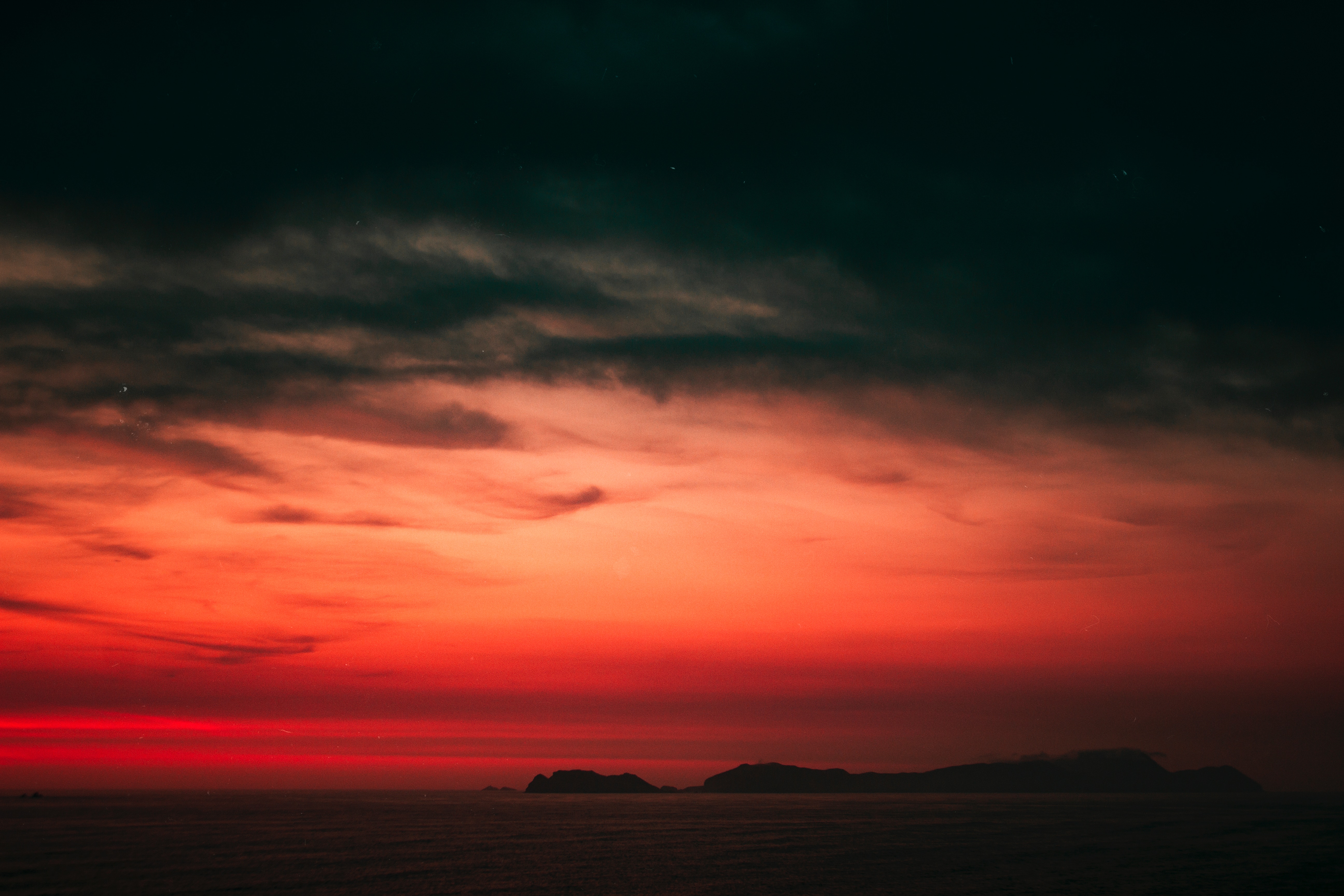 Sunset over the sea with islands near San Isidro, Peru HD Wallpaper