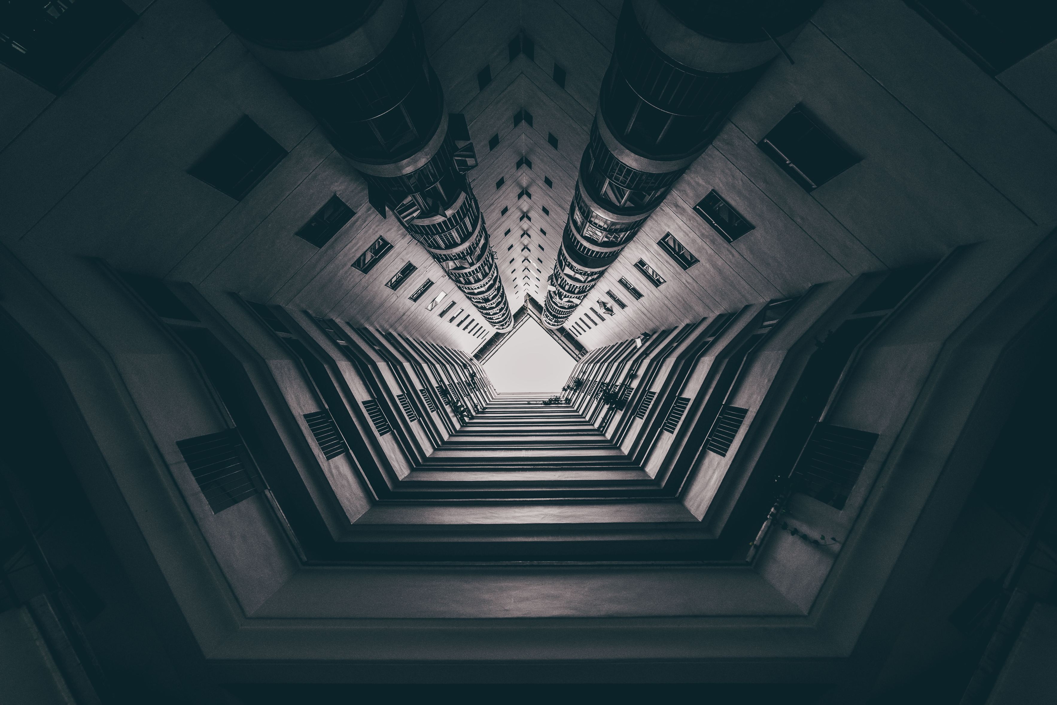 Looking up at a modern building with balconies HD Wallpaper