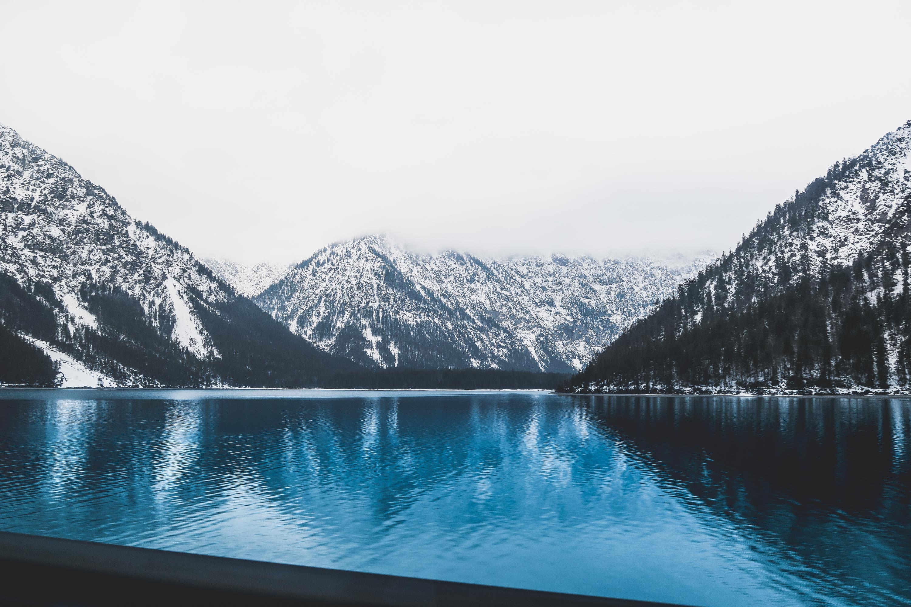 Snow-covered mountains and a lake in Austria HD Wallpaper