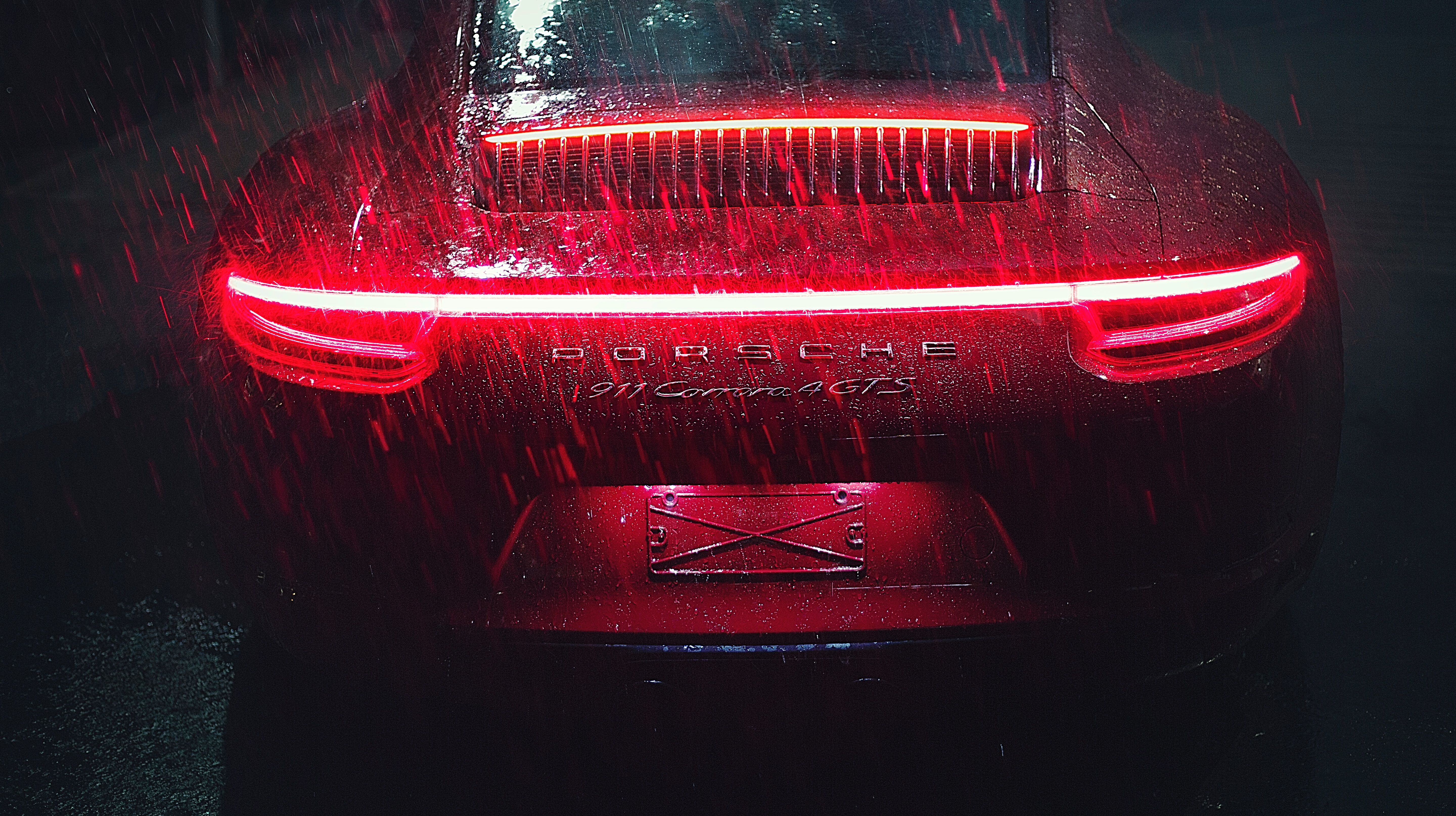 Red Porsche 911 Carrera GTS in the rain HD Wallpaper