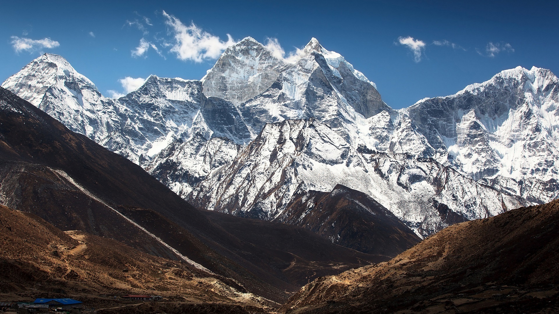 Snowy Himalayan mountain range under a blue sky HD Wallpaper