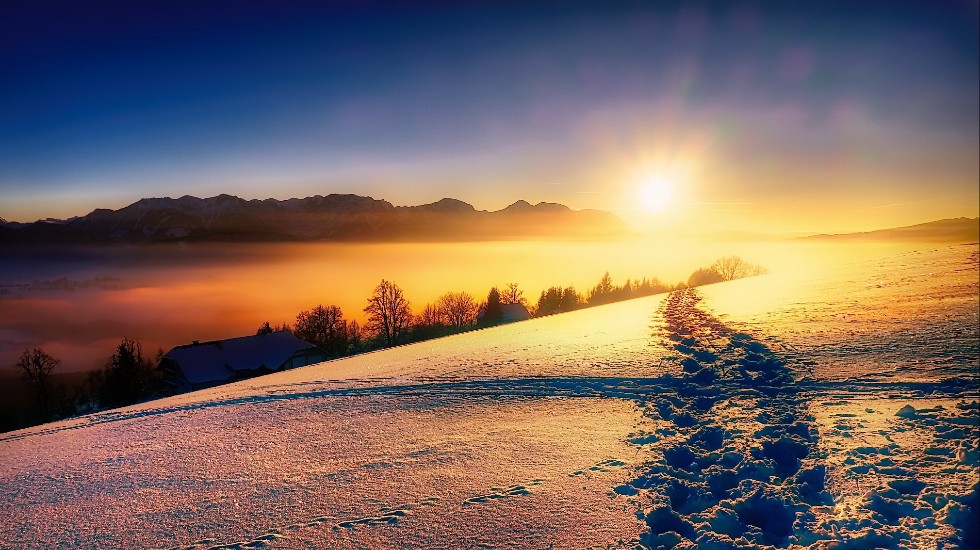 Winter landscape with snow-covered hills and mountains at sunrise HD Wallpaper