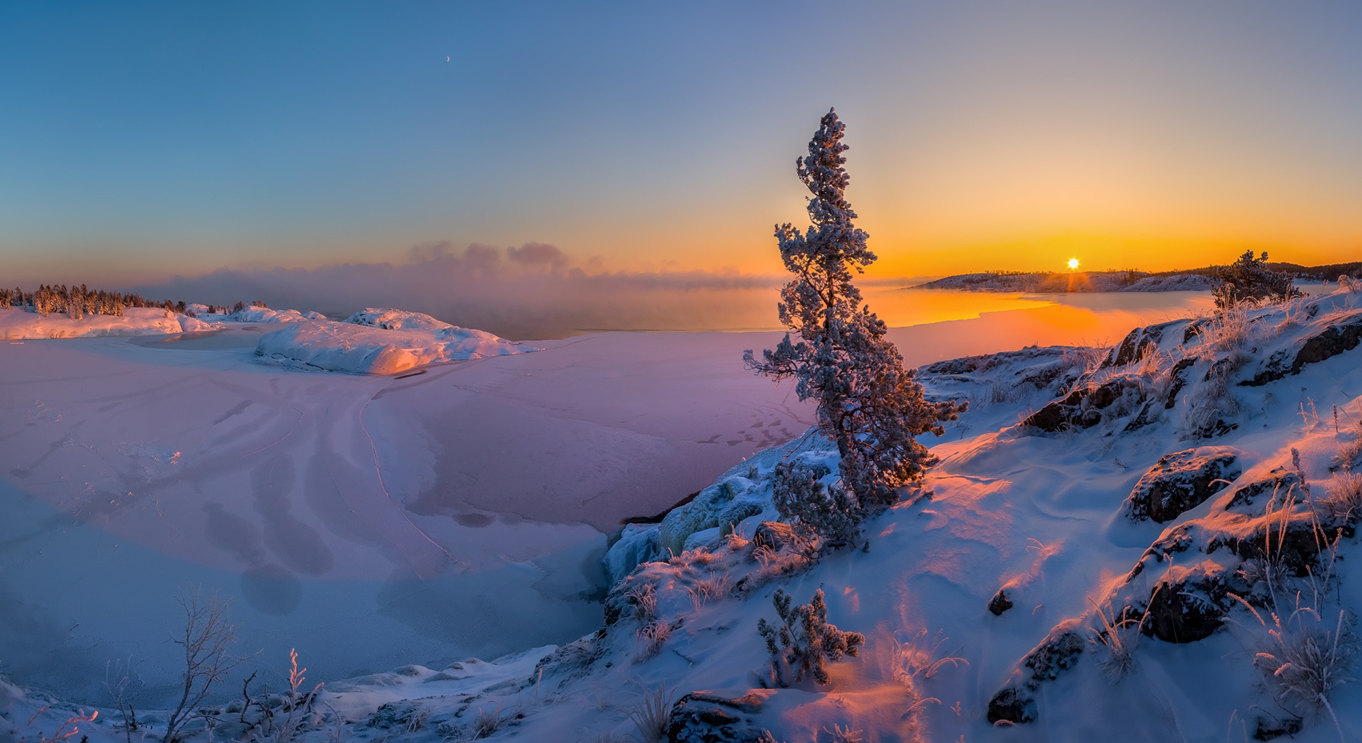Snowy landscape at sunset with frozen lake HD Wallpaper