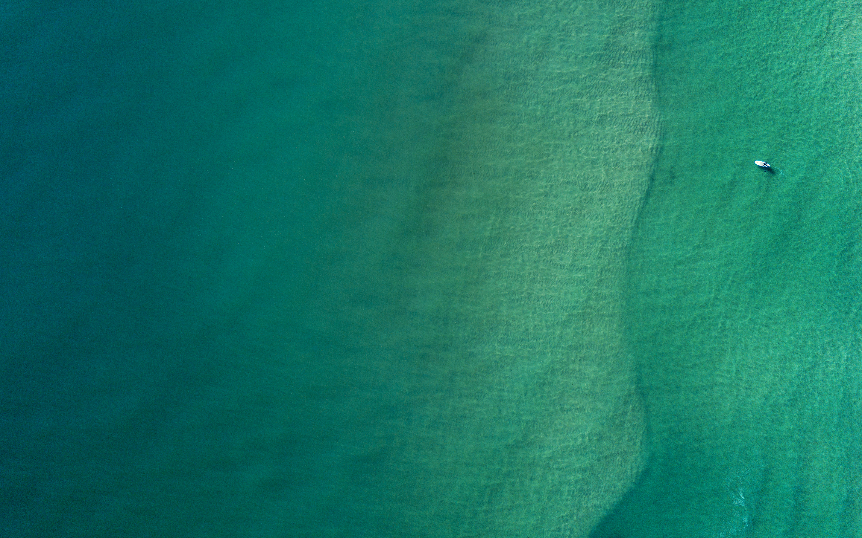 Minimalist aerial view of turquoise ocean water HD Wallpaper